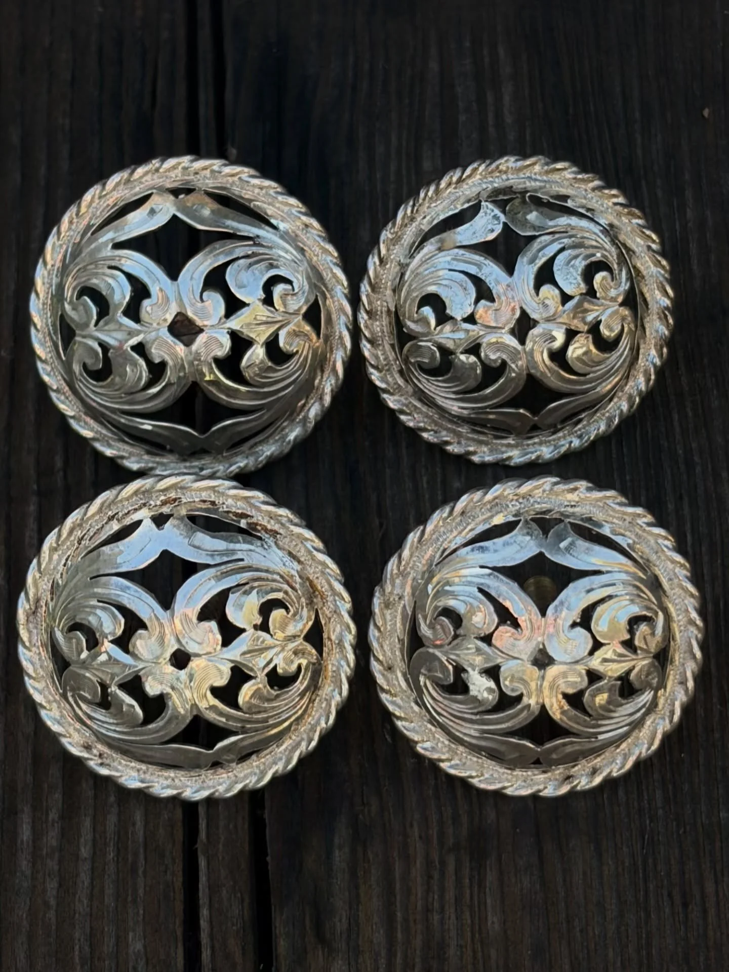 Vintage 1.5&rdquo;&rdquo; Sterling Silver Filigree Conchos with saddle screws marked &lsquo;STERLING&rsquo;
Available here: https://theoldspanishtrading.com/silver-buckles-and-conchos/old-ca-style-4jyt5-fkx4w

Very nice 1960&rsquo;s era matching set 