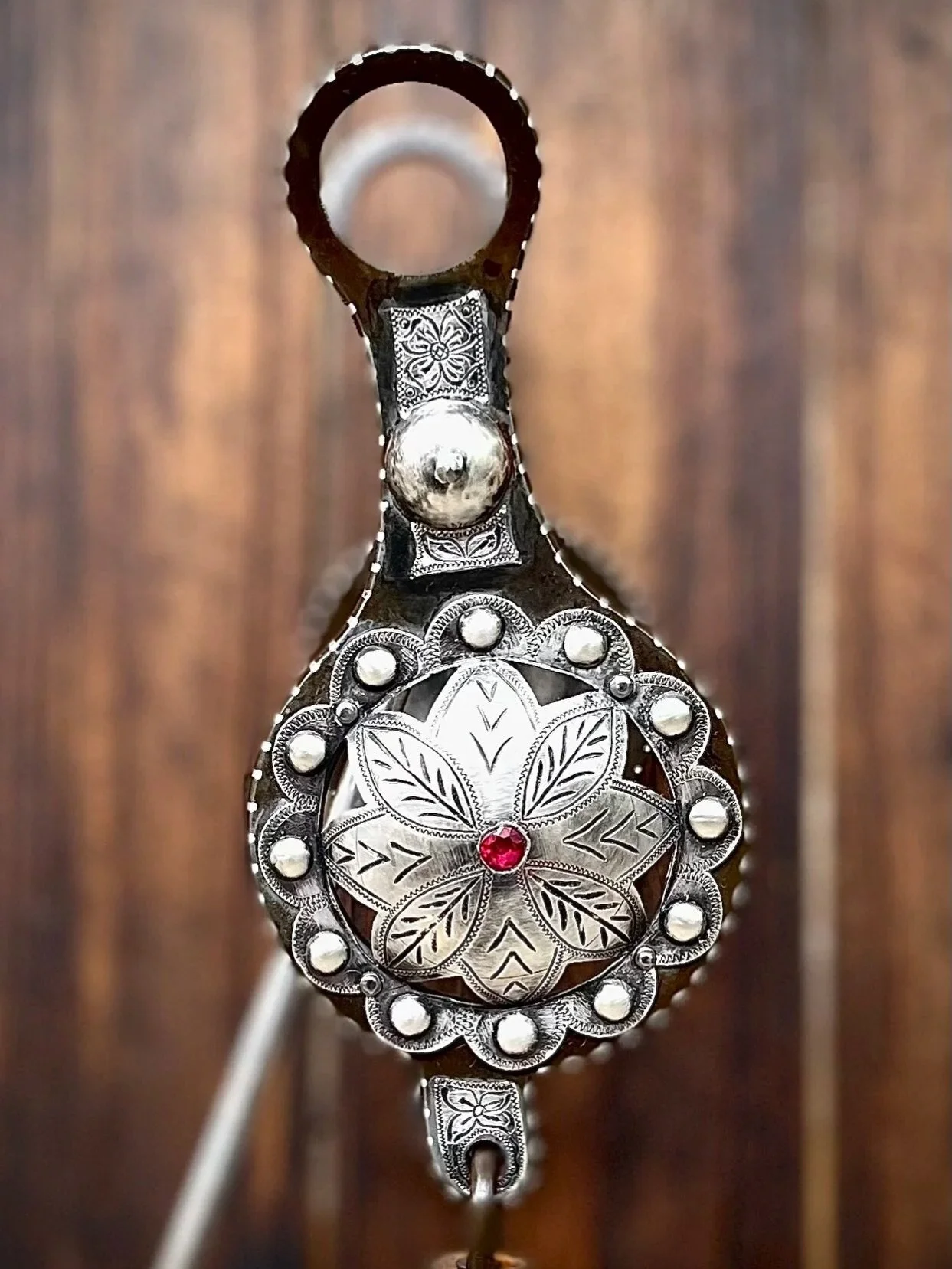 IN STOCK ✨✨Old Fashioned Globe bit with sterling punched flowers and ruby stones, and traditional spade mouthpiece✨✨
Available for purchase here:  https://theoldspanishtrading.com/bits/globe-spade 

A modern example of an old style globe or grazer bi