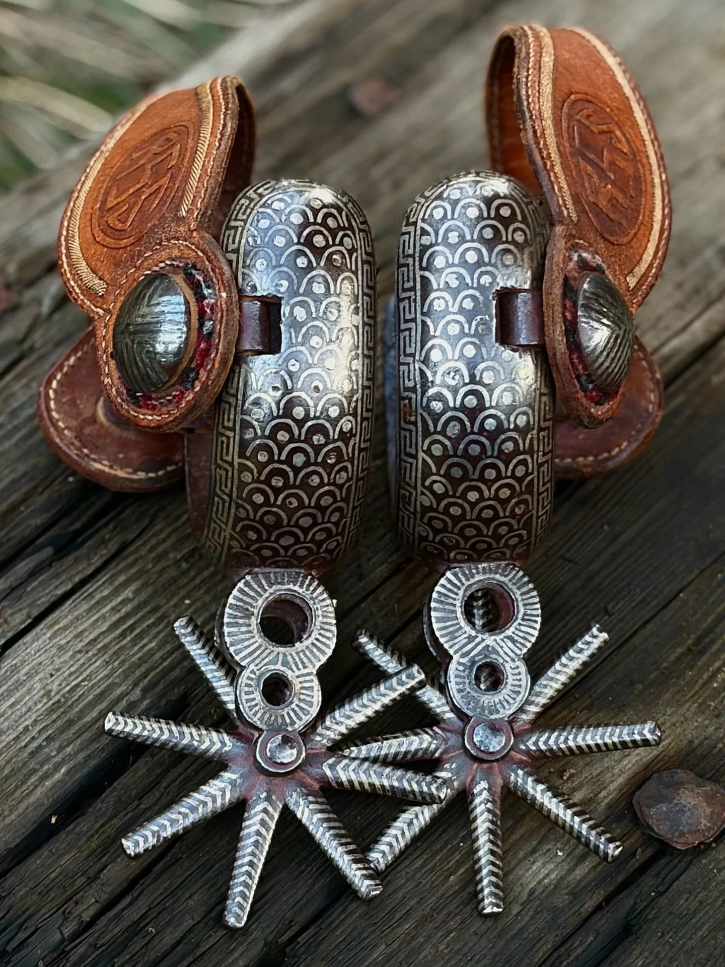 Antique Mexican spurs with double mounted silver inlay and original antique leather and piteado straps
Available for purchase here: https://theoldspanishtrading.com/spurs/large-antique-mex-spurs 

This is a rare and unique set of large Mexican charro