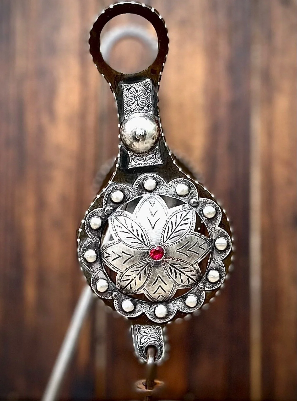 IN STOCK Old Fashioned Globe bit with sterling punched flowers and ruby stones, and traditional spade mouthpiece

Available for purchase here: https://theoldspanishtrading.com/bits/globe-spade 
A modern example of an old style globe or grazer bit. Th