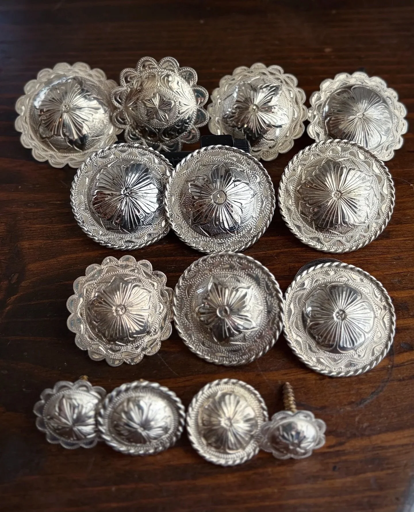 ✨ Huge lot of 14 assorted vintage sterling silver conchos ✨
Available here: https://theoldspanishtrading.com/silver-buckles-and-conchos/lot-conchos

Huge lot of 14 assorted vintage sterling silver conchos.  All were made circa 1960s and are new old s