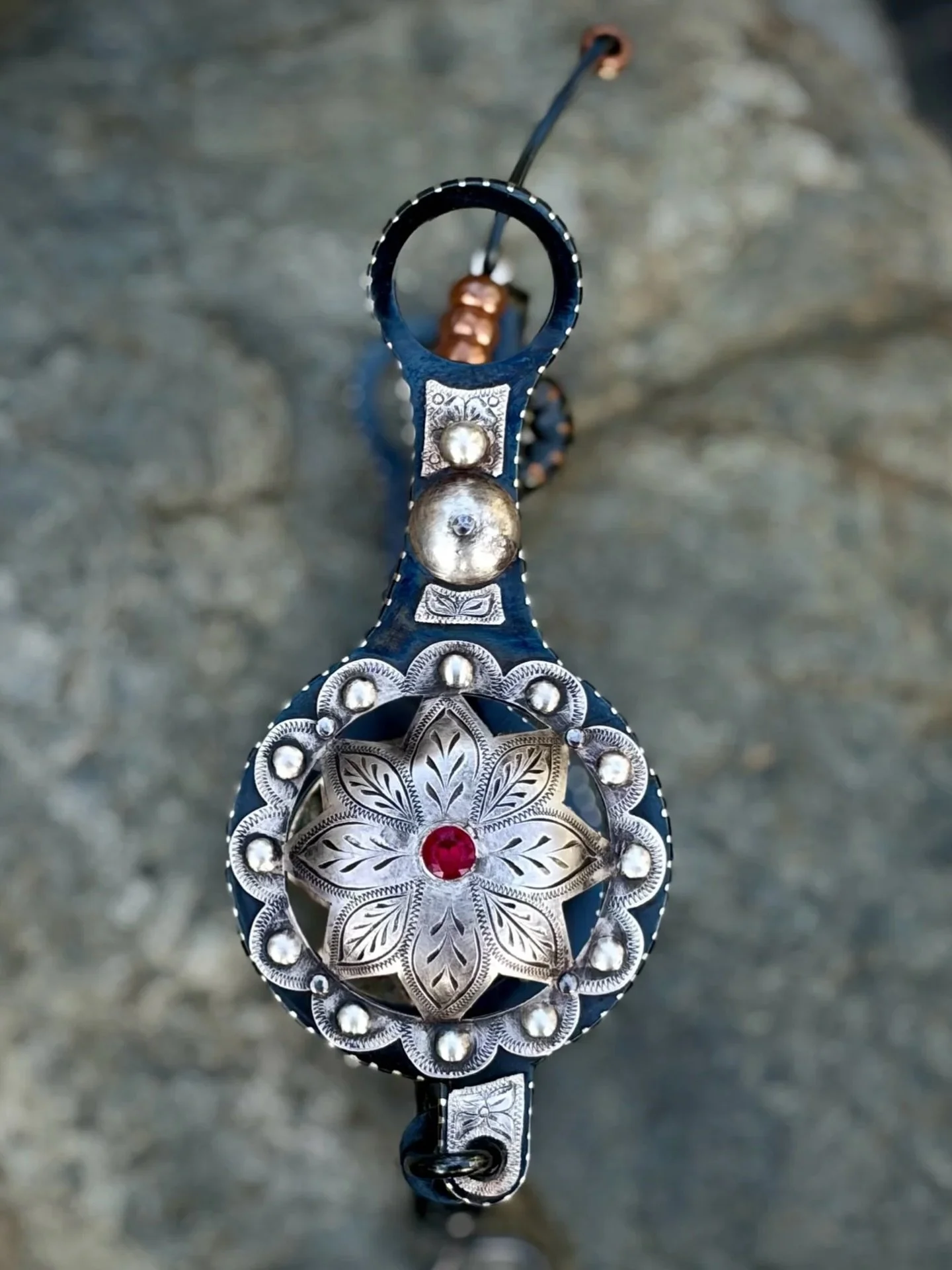 IN STOCK Old Fashioned Globe bit with sterling punched flowers and ruby stones, and traditional spade mouthpiece
Available for purchase here: https://theoldspanishtrading.com/bits/globe-spade

A modern example of an old style globe or grazer bit. Thi