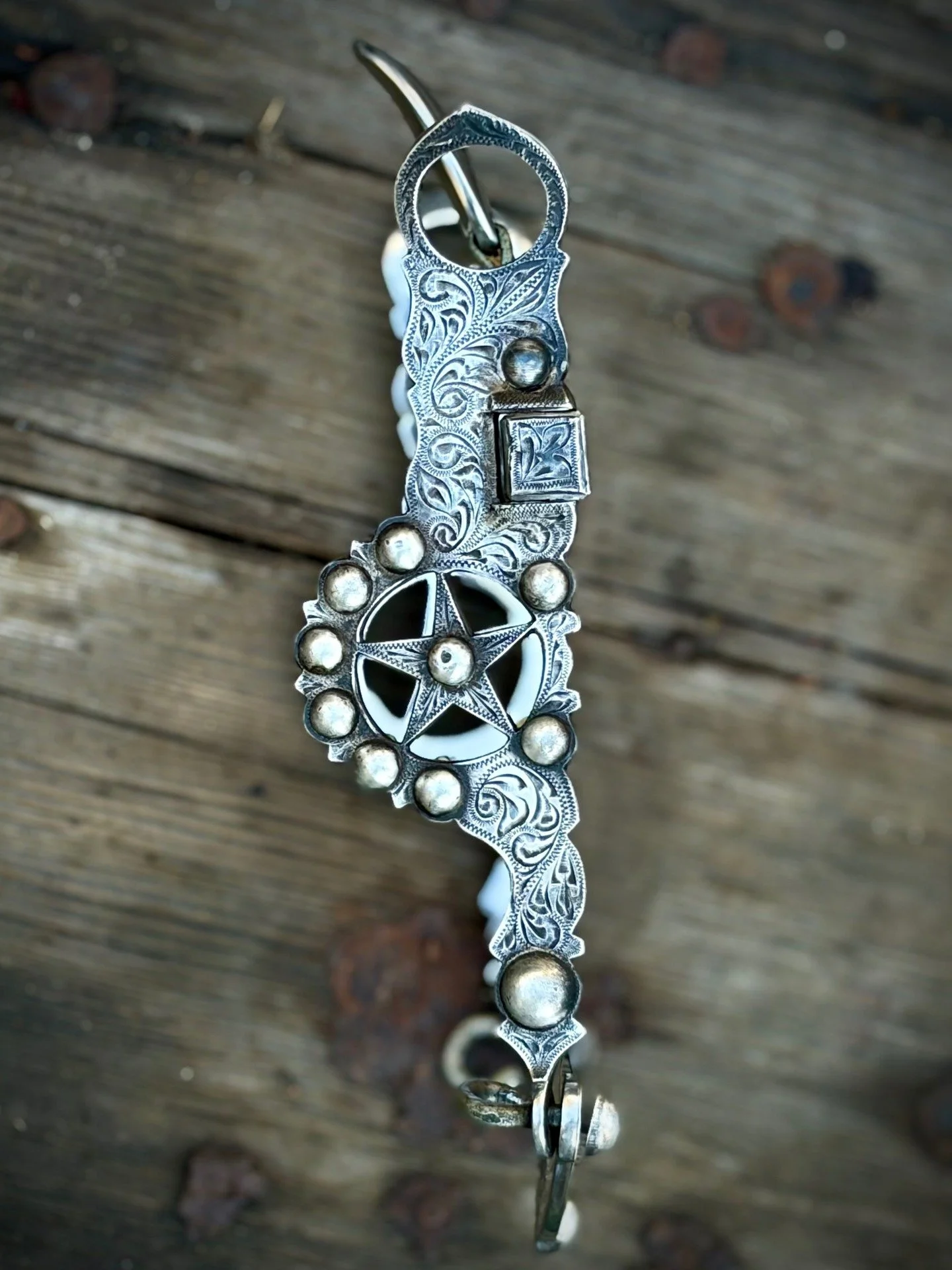 Les Garcia Elko star cheek bit with full sterling silver overlay and spade mouthpiece. Available for purchase here: https://theoldspanishtrading.com/bits/vintage-eko-star-silver-overlaid-les-garcia-spade-bit 

In pristine condition for its age as it 