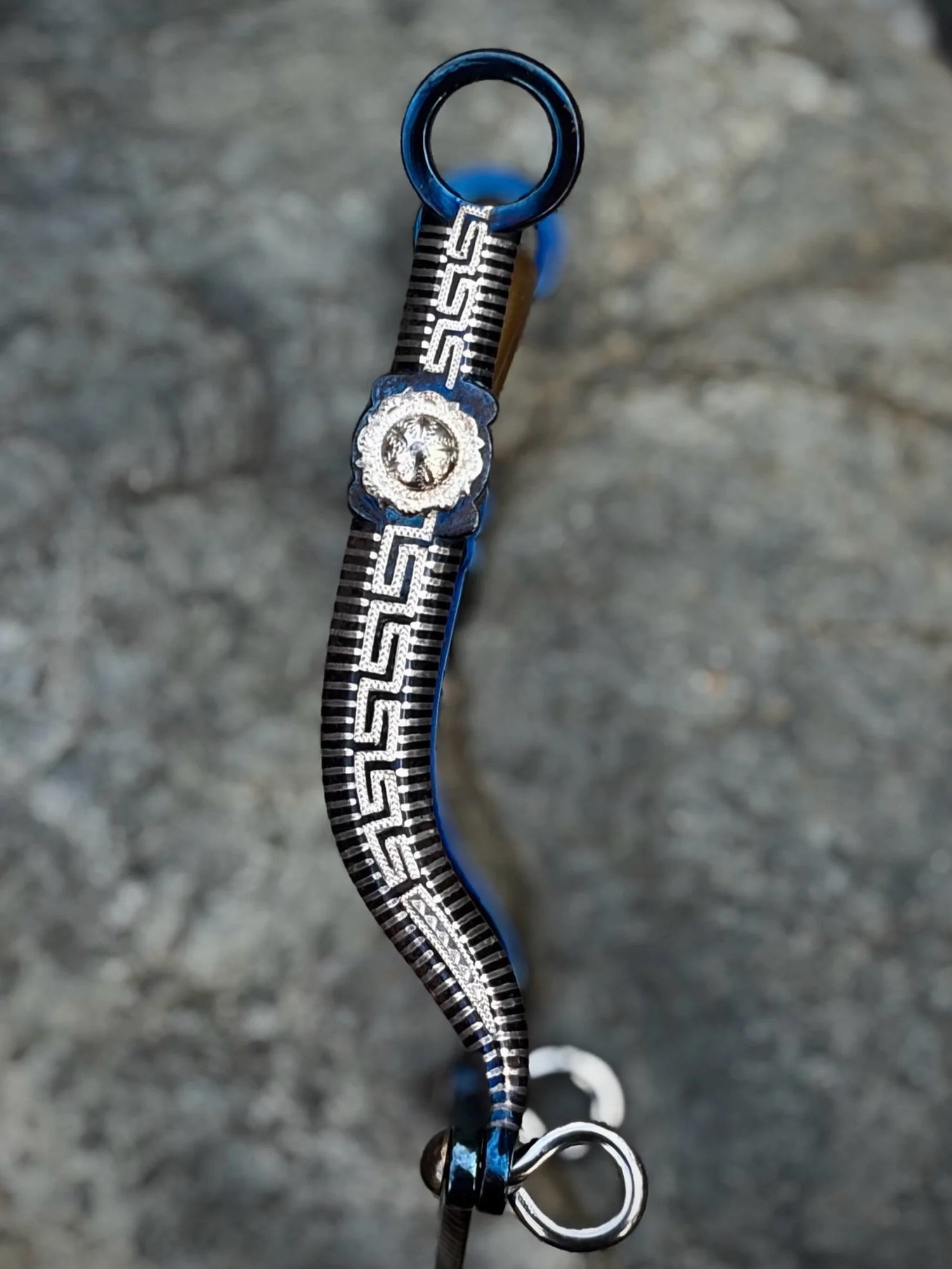 Here&rsquo;s a real cutie of a bit.  Really nice vintage Greek Key cheek bit with exceptional sterling silver inlay and engraving by the late Frank Rocha.  The cheeks have blued iron and have a nice amount of movement. 5 1/8&rdquo; wide Salinas mouth