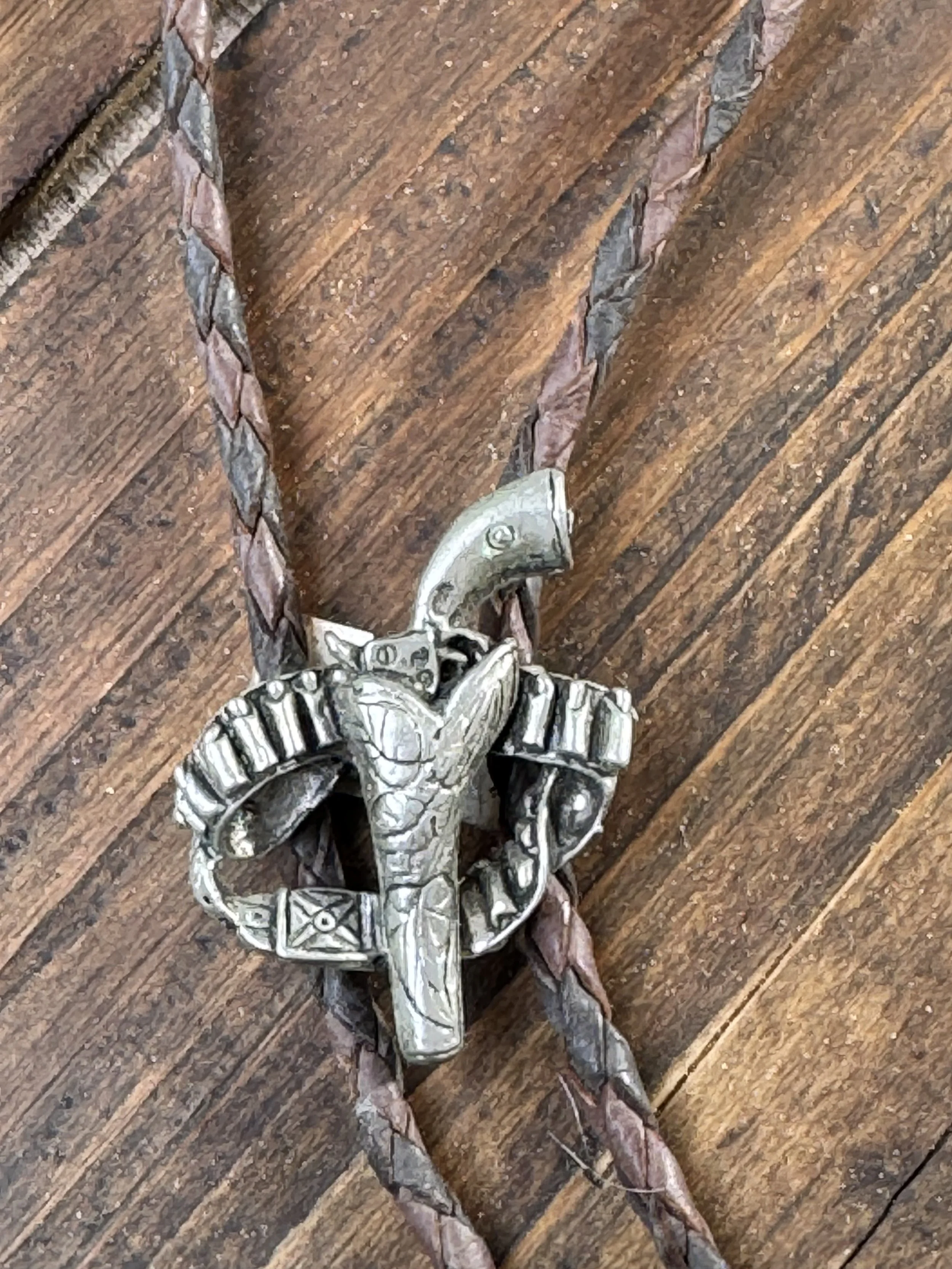 Pistol, holster and gun belt sterling bolo tie