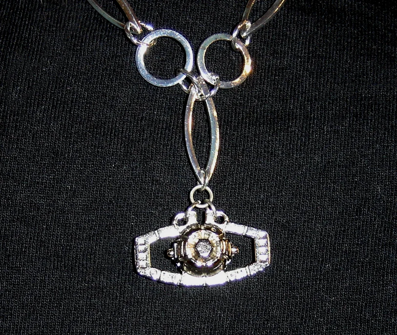 Aaron would like one of these, maybe 4" across. Perhaps you could go through Jacob the Jeweler . Credit where credit is due; this pic is from Cally Karishokka's Deviant Art page . Go check it out.