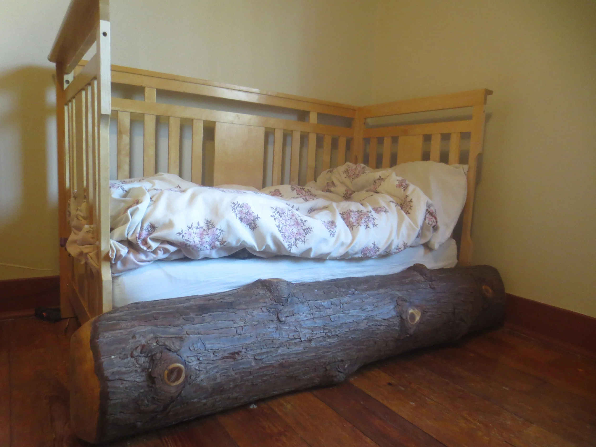  Toddler bed crib-converter log. Bark on, oiled. 210. 