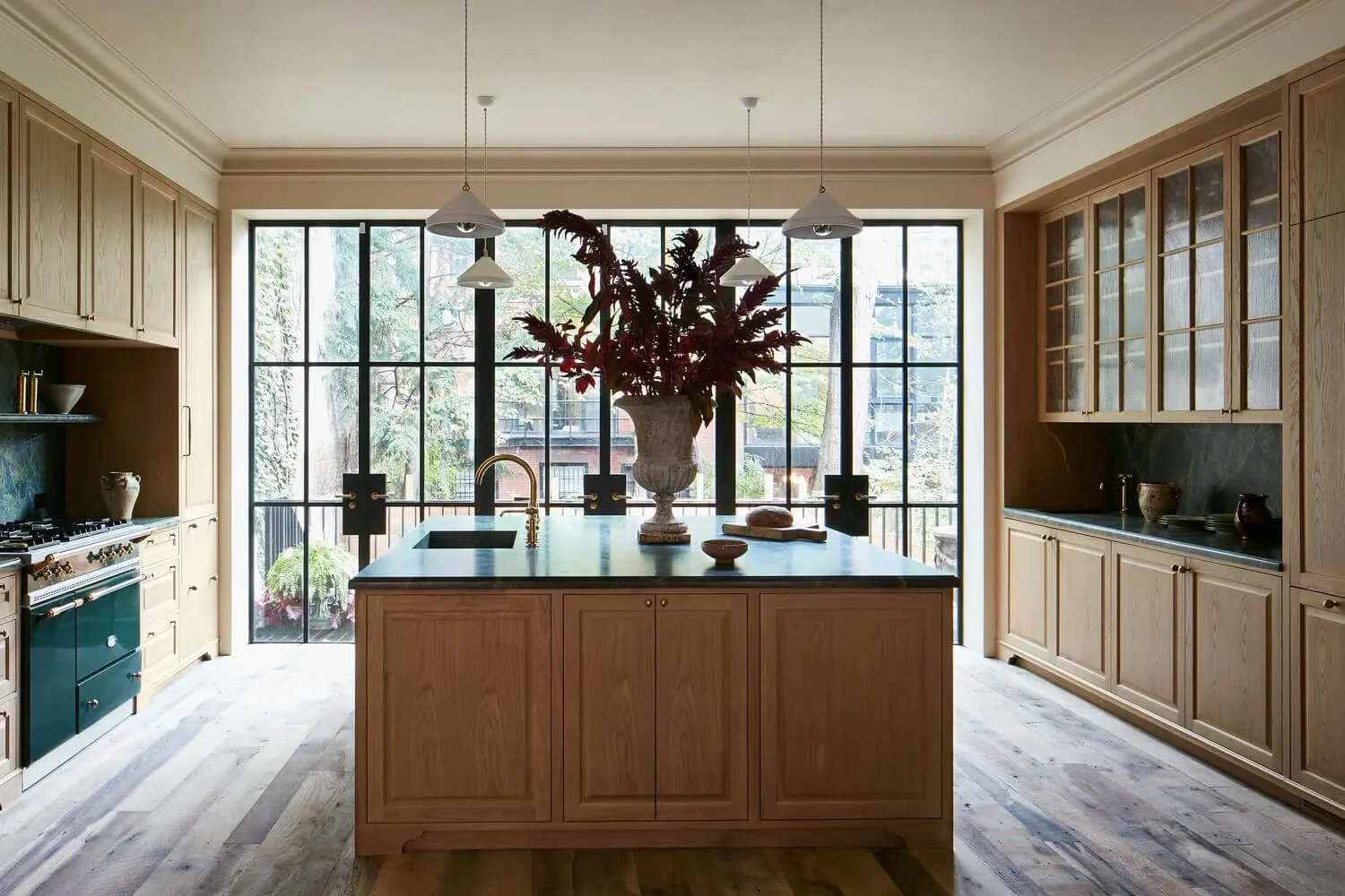 Inspiration image of wood kitchen with green range, design by Studio Brandon Sanchez.