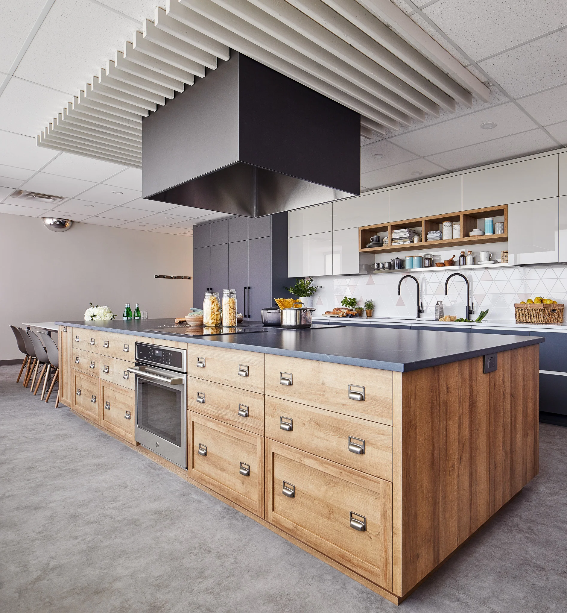 New kitchen offers a lot of storage, doubles of all appliances and a generously sized island with plenty of counter surface to facilitate usage of the kitchen by large groups.