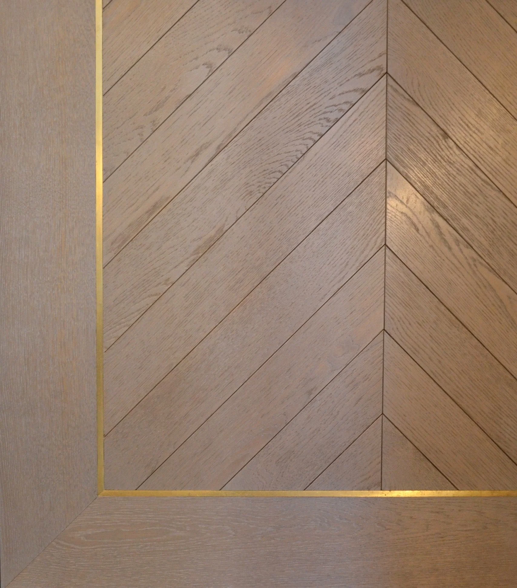 Oak Chevron Flooring with brass inlay