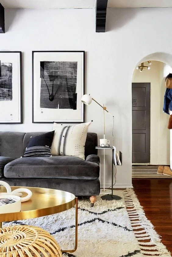 Brass and velvet feel very luxe in this living room. Image Source: My Domaine
