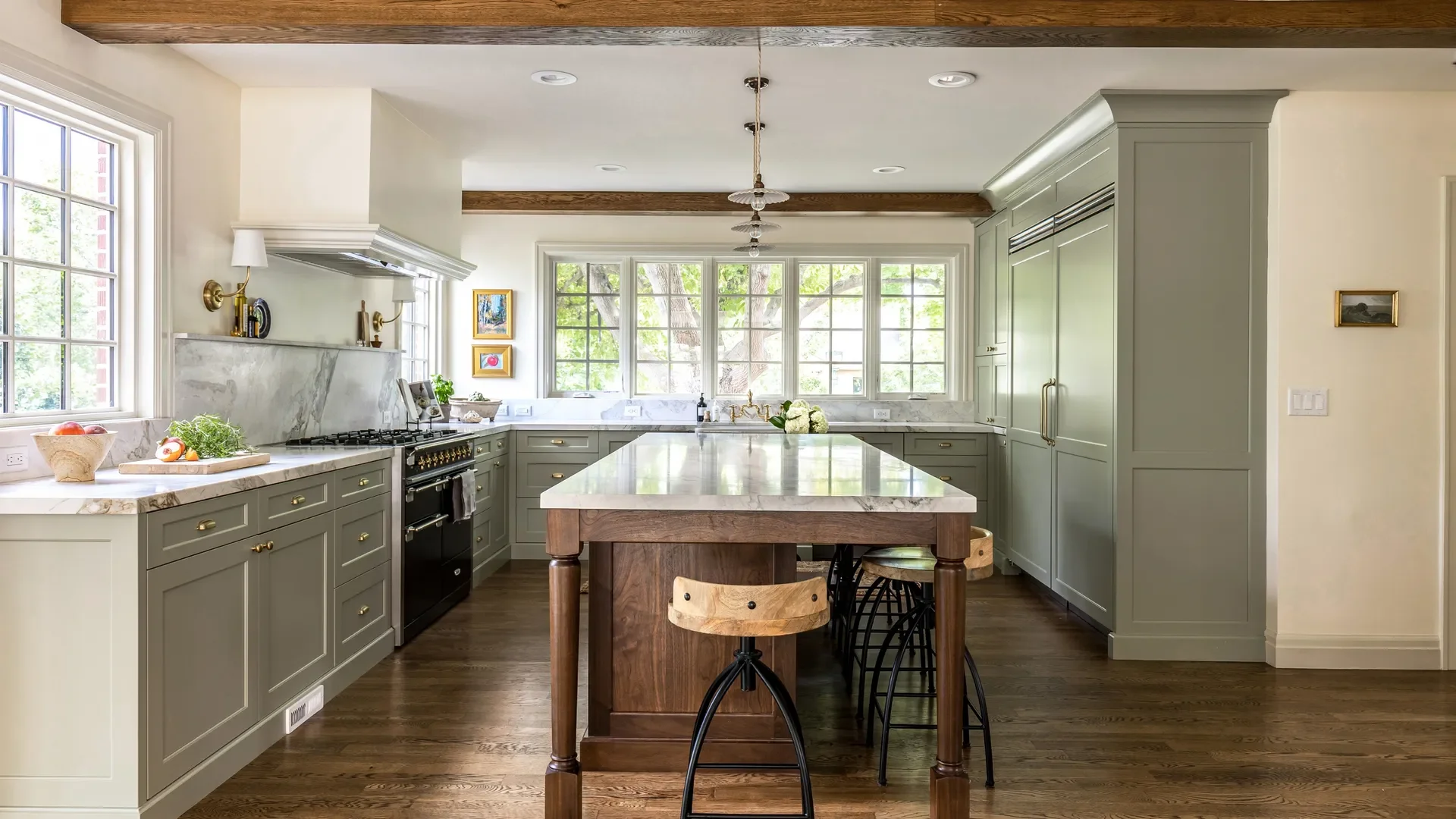 Inspiration image of traditional kitchen in soft sage color with walnut island, design by Mad Luxe.