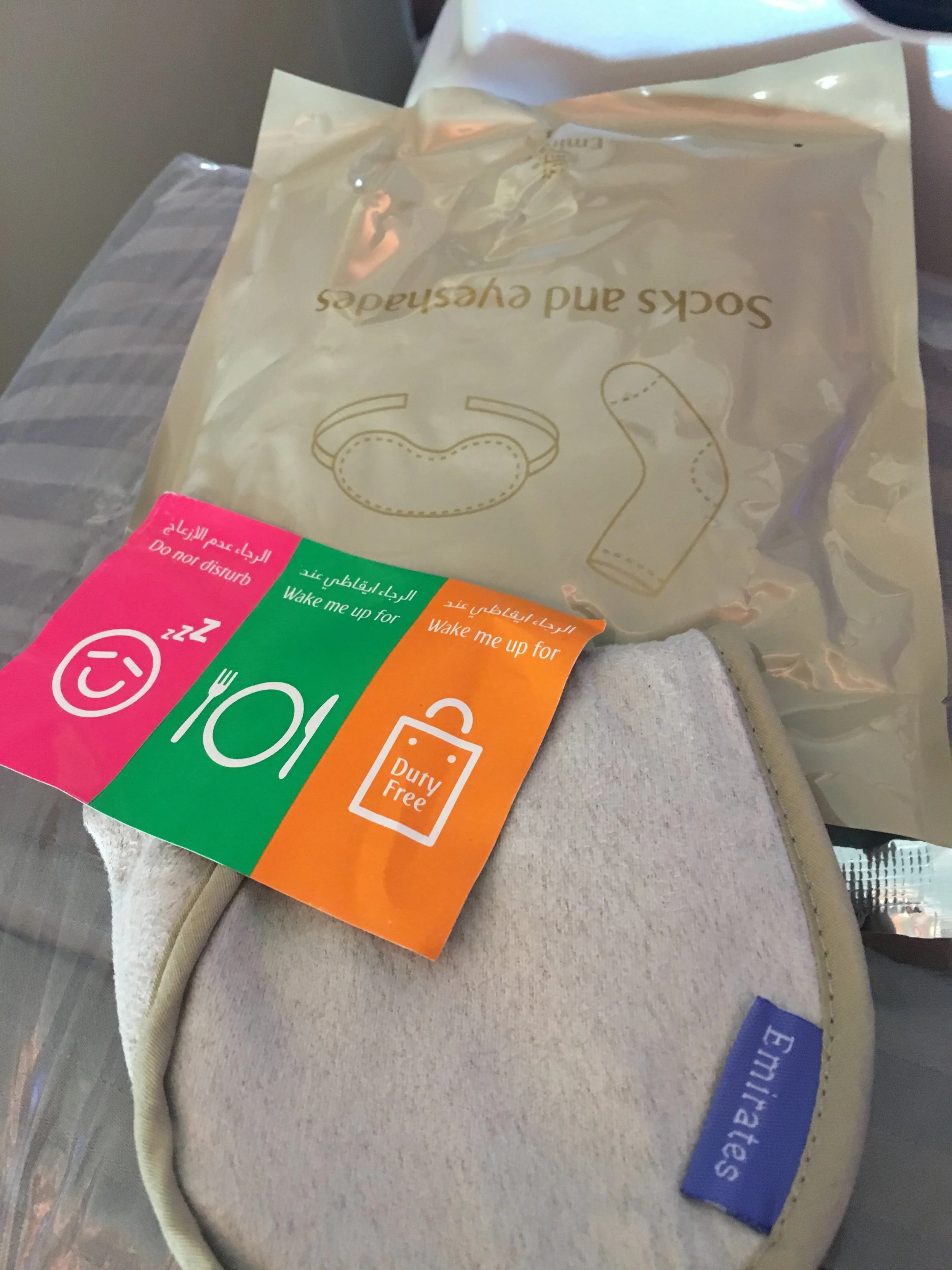 The three stickers for the top your seat to tell the FA how you want to be "treated" today. Also socks and eyeshades in a plastic bag - rather than an amenity kit.