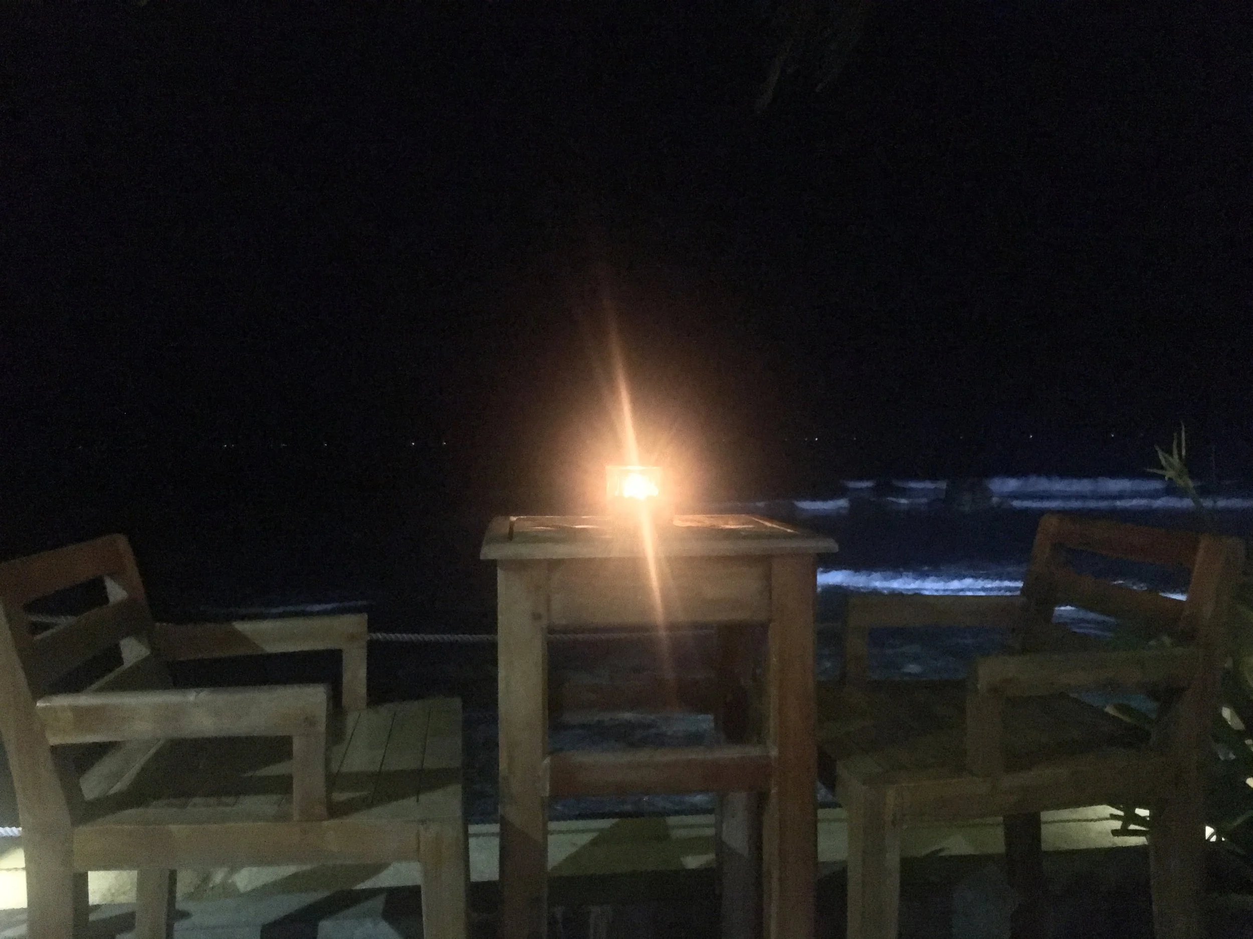 A few of these romantic bar tables directly at the water