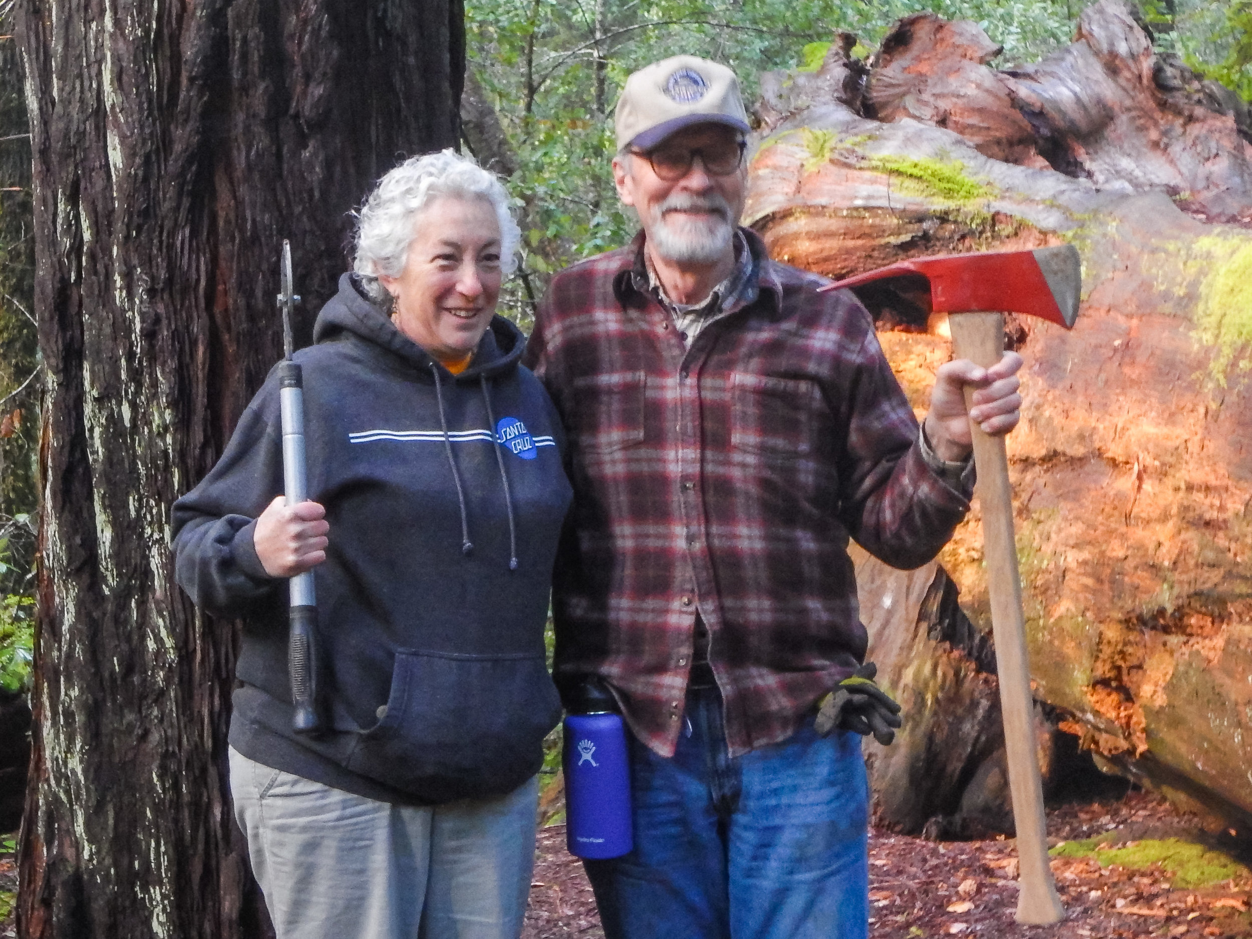 Mimi and Steve at the tree dedicated to their daughter Rebecca who is now 29. Both were much smaller when it was dedicated.