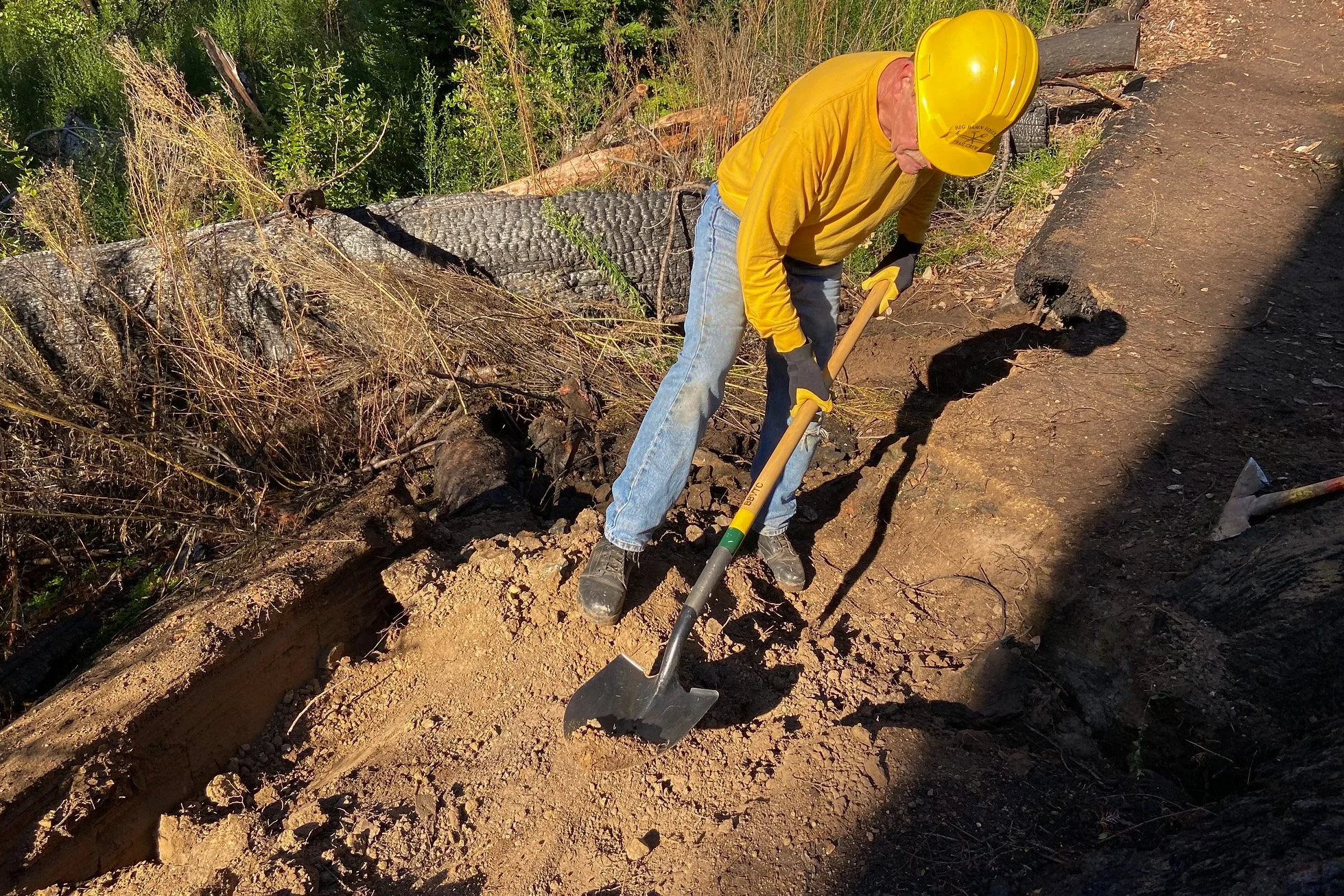 rerouting - remove soil and rocks from damaged trail section.JPG