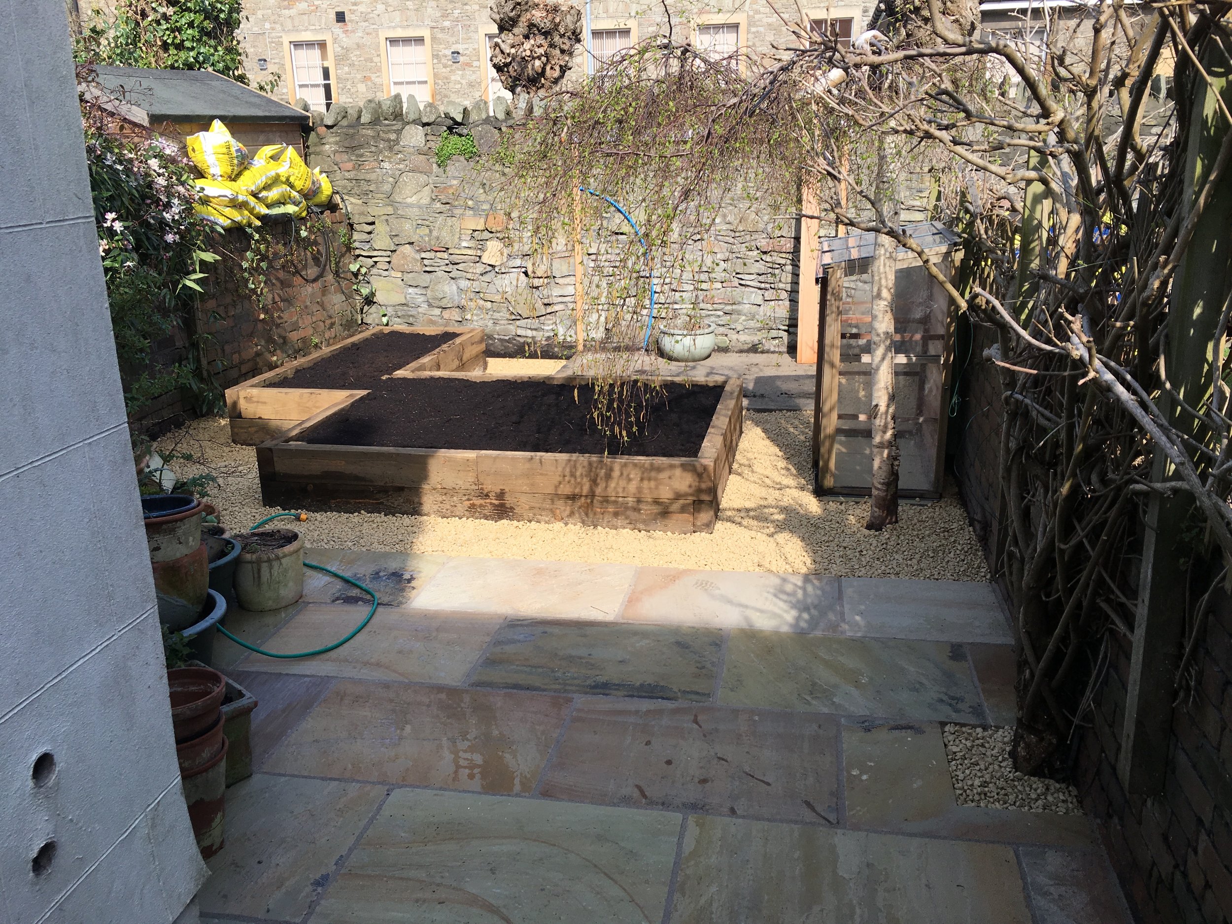 Sandstone Paving + Raised Beds in Bristol