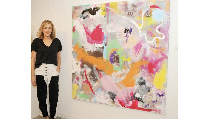 Joanne Handler with her painting at The White Room Gallery in Bridgehampton, NY.