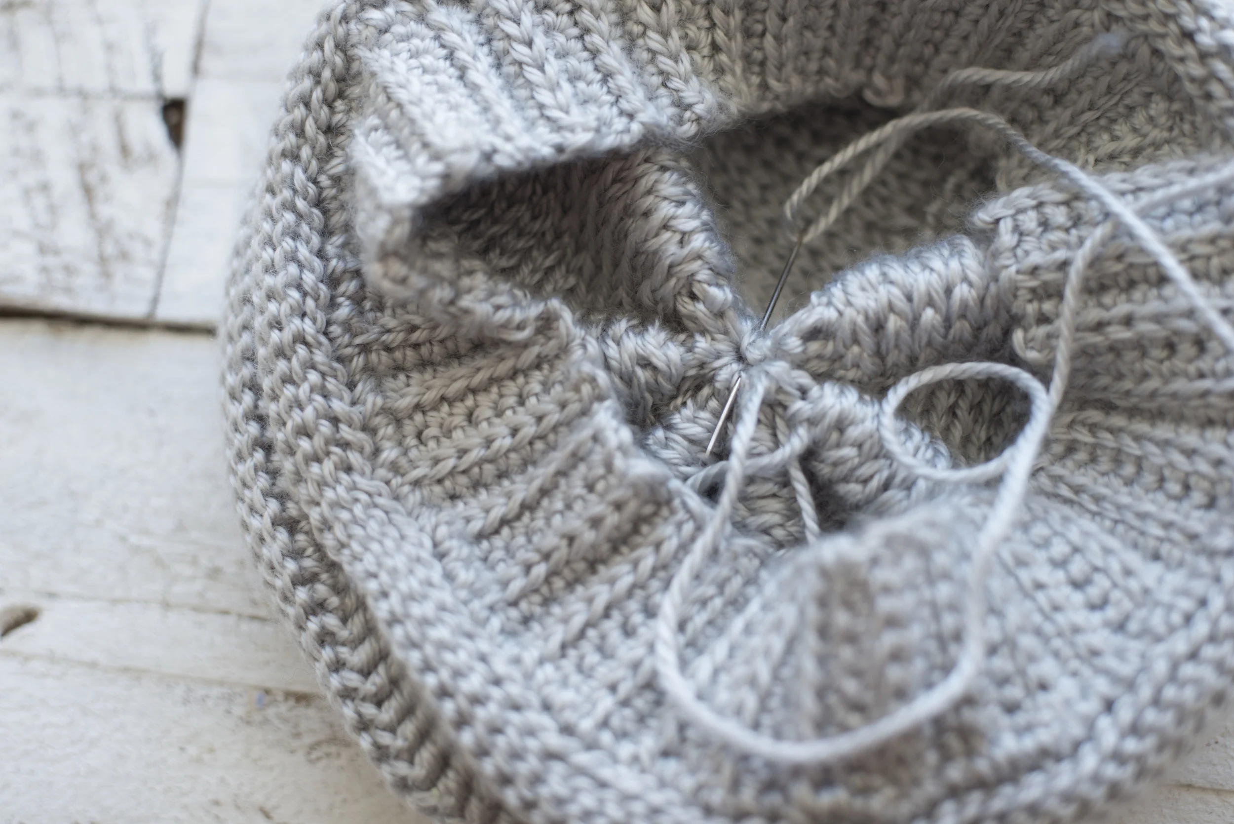 Above is a photo of the hat being "secured" after already being gathered.