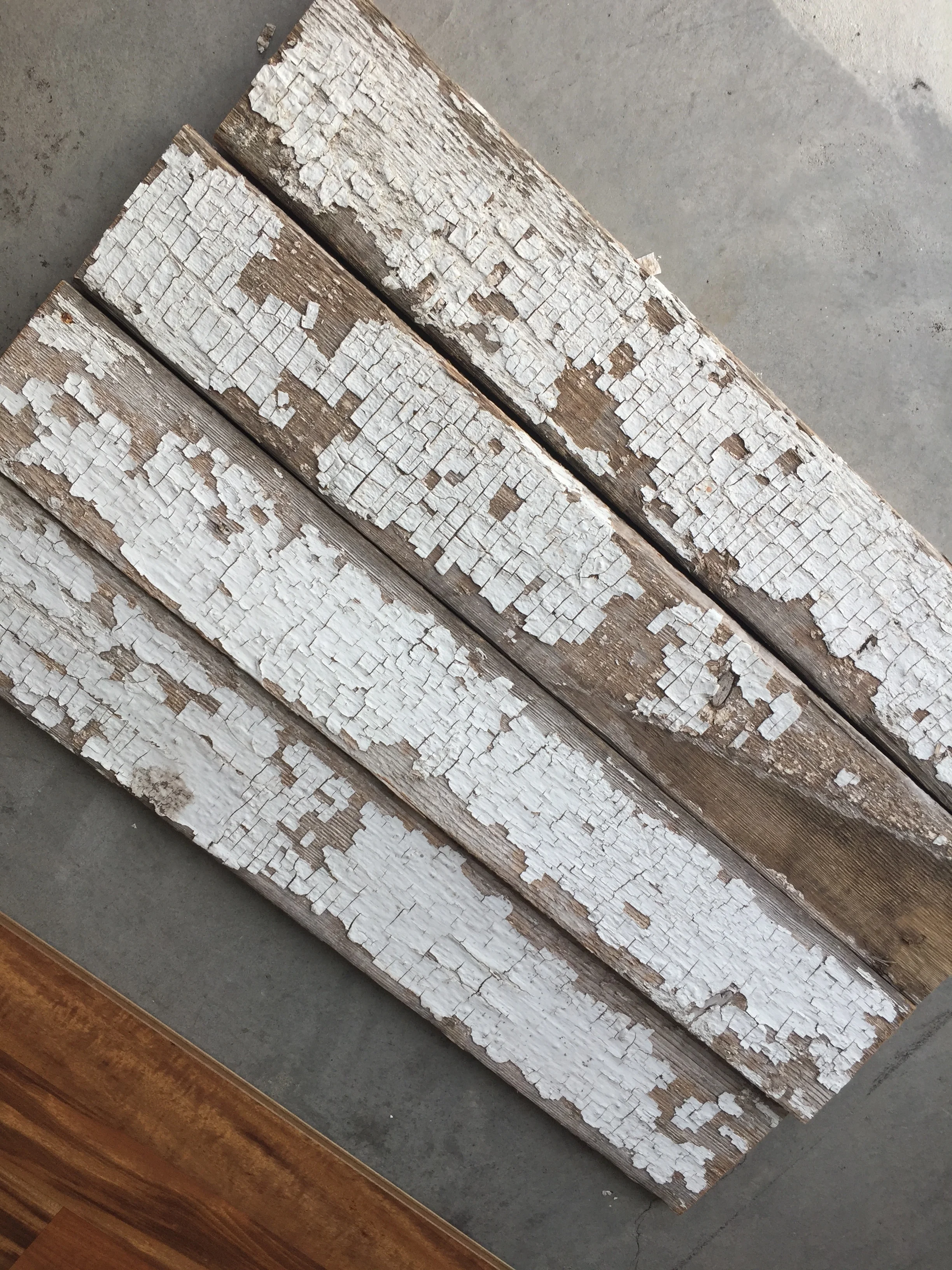 These pieces of wood were actually one huge piece of old barn wood to begin with. I found it at a re-use it center and had them cut it for me into these pieces! I love love love the chippiness.