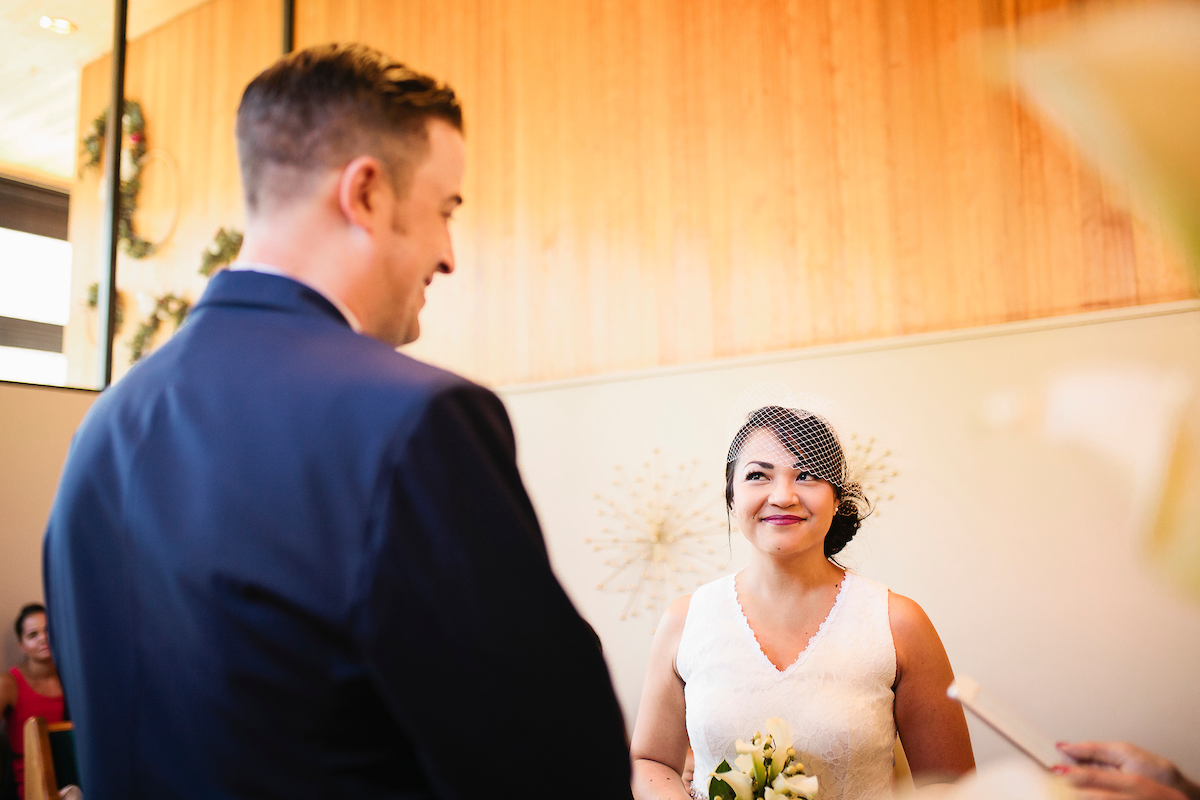 Bride glancing at Groom