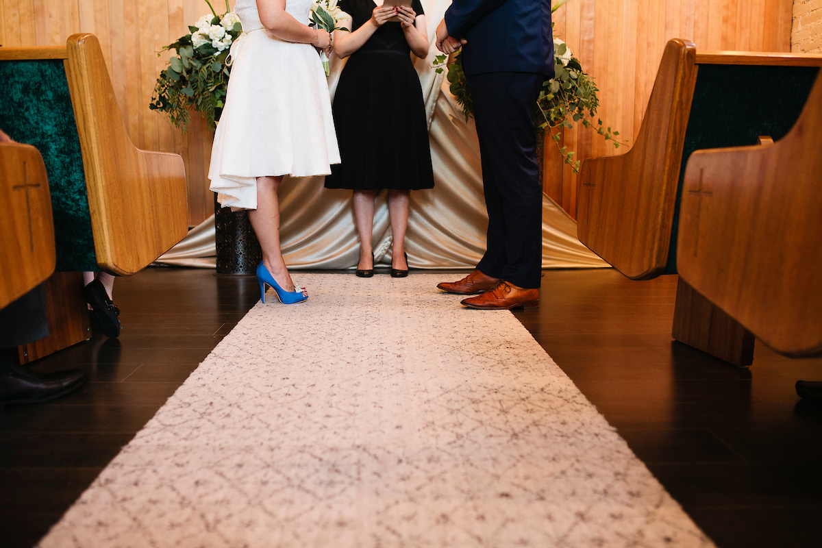 Close up of bride and groom shoes