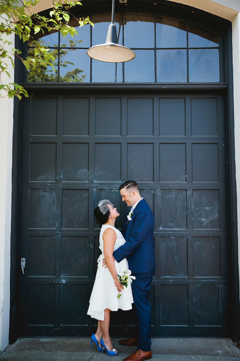Wedding photo in front of garage door in Tacoma