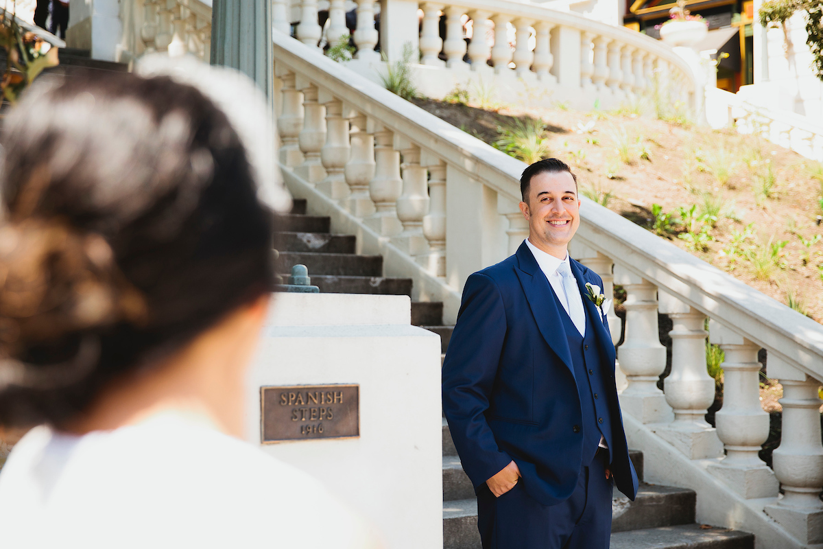Groom looking at bride on Broadway in Tacoma