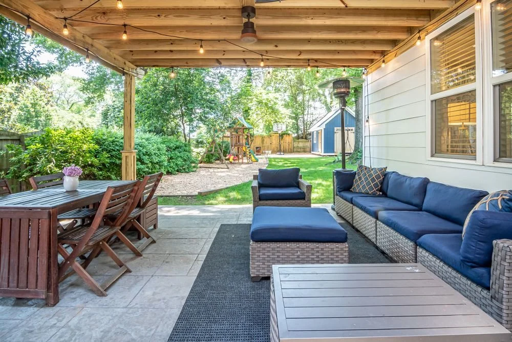 Covered backyard patio with outdoor seating