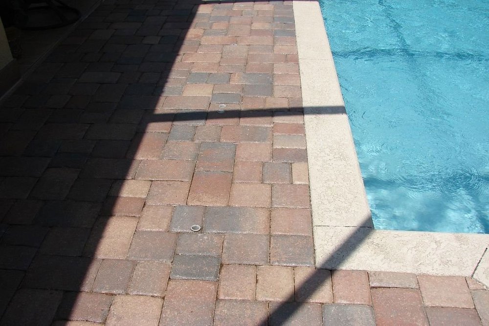 Travertine vs Concrete Pavers Pool Deck — Aviara Pavers