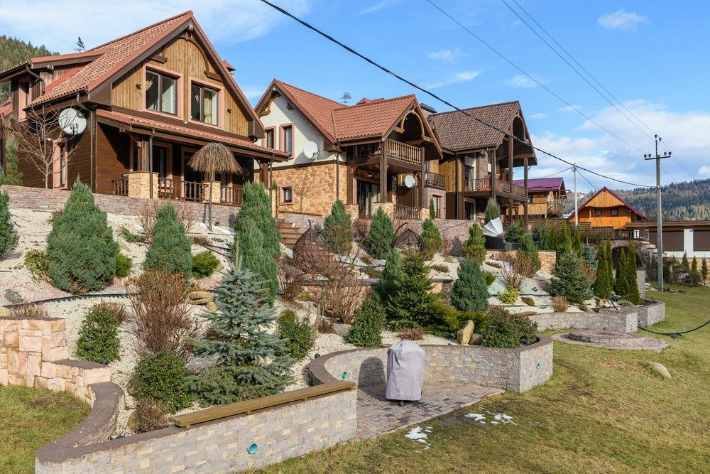 Hillside homes with tiered retaining walls