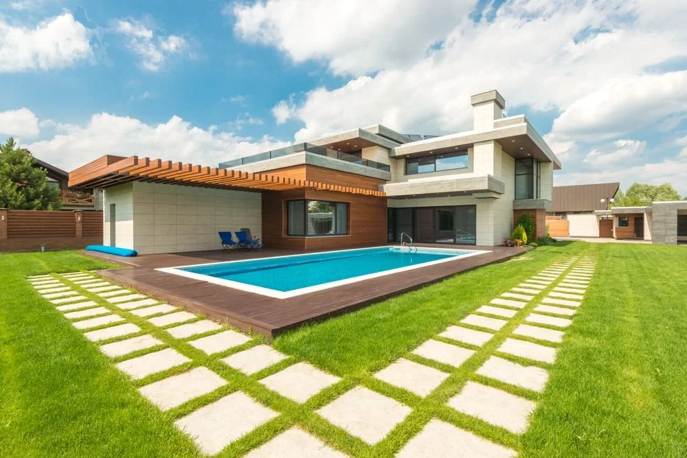 Modern backyard pool with large porcelain pavers