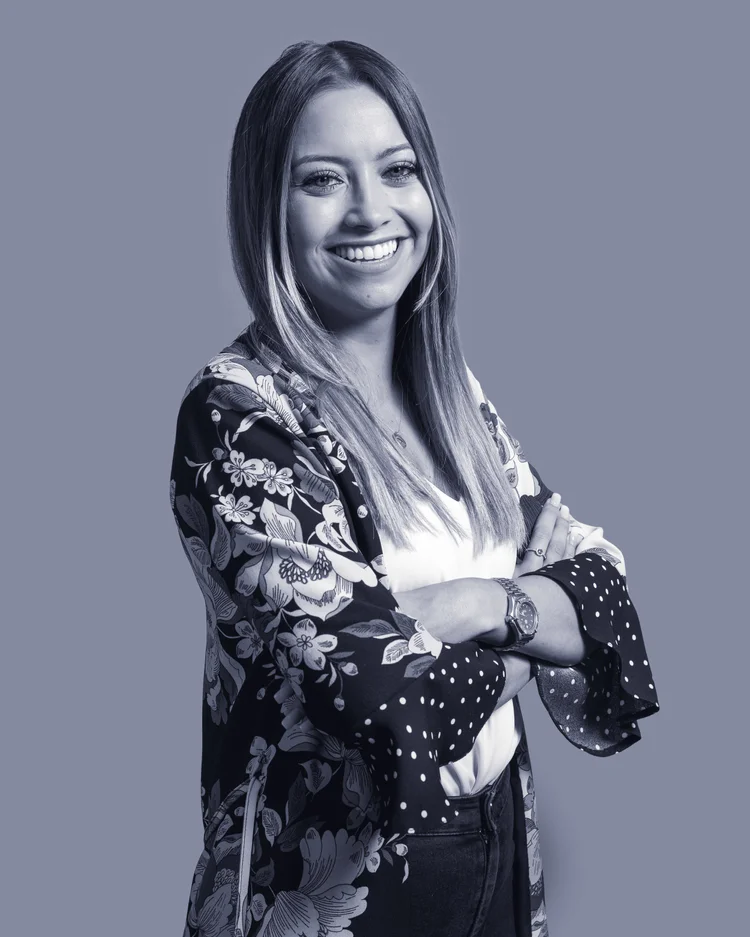 Black-and-white portrait of an Imagine Estate Agency team member in a patterned blouse