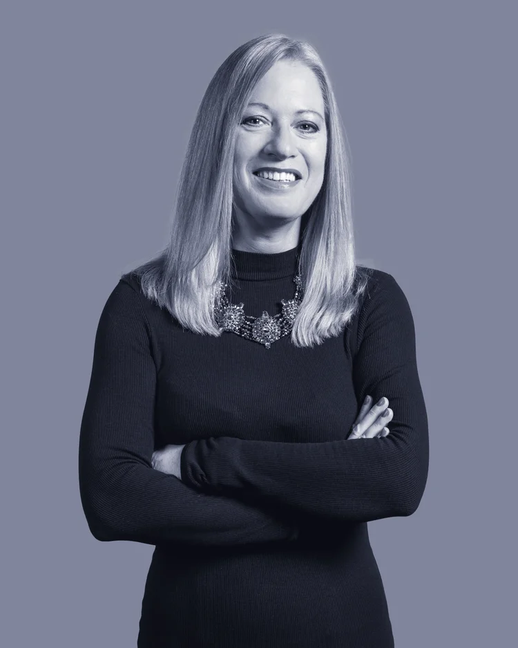 Black-and-white portrait of an Imagine Estate Agency team member with a statement necklace