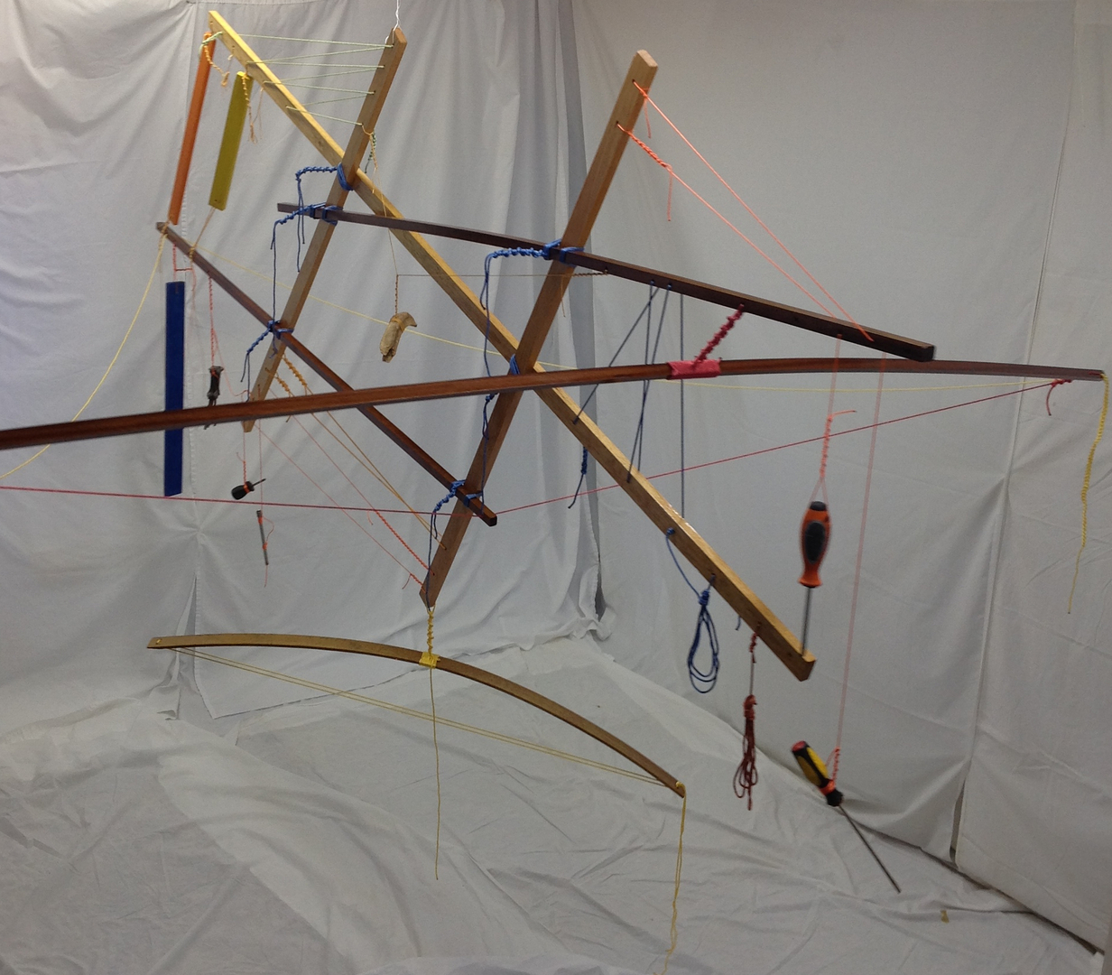 Suspended animation 2014 · cypress, sapele, maple, spar varnish, crayon, nylon rope, dye, found tools · "Cool-Breeze(TM)" fan · 96"x106"x60"