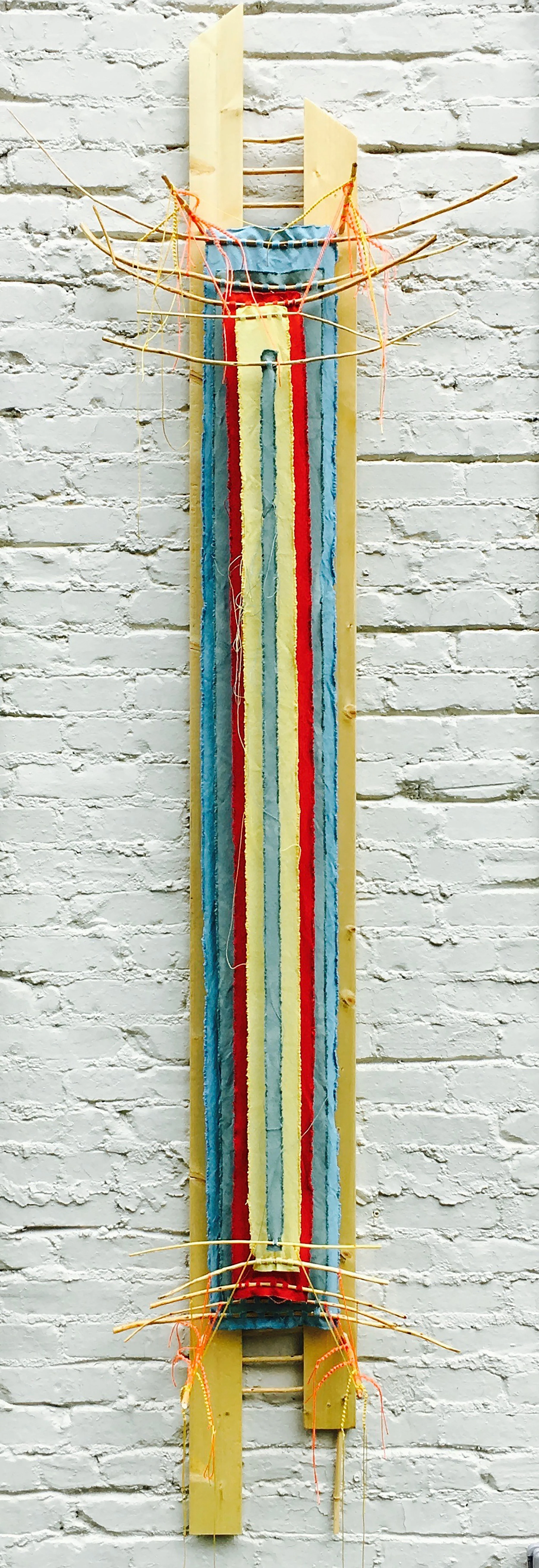 Twin-entangled Stele, backward glance 2017 · found board/sticks, cedar pegs, canvas, string, dye, varnish · 101"x33"x7.5"