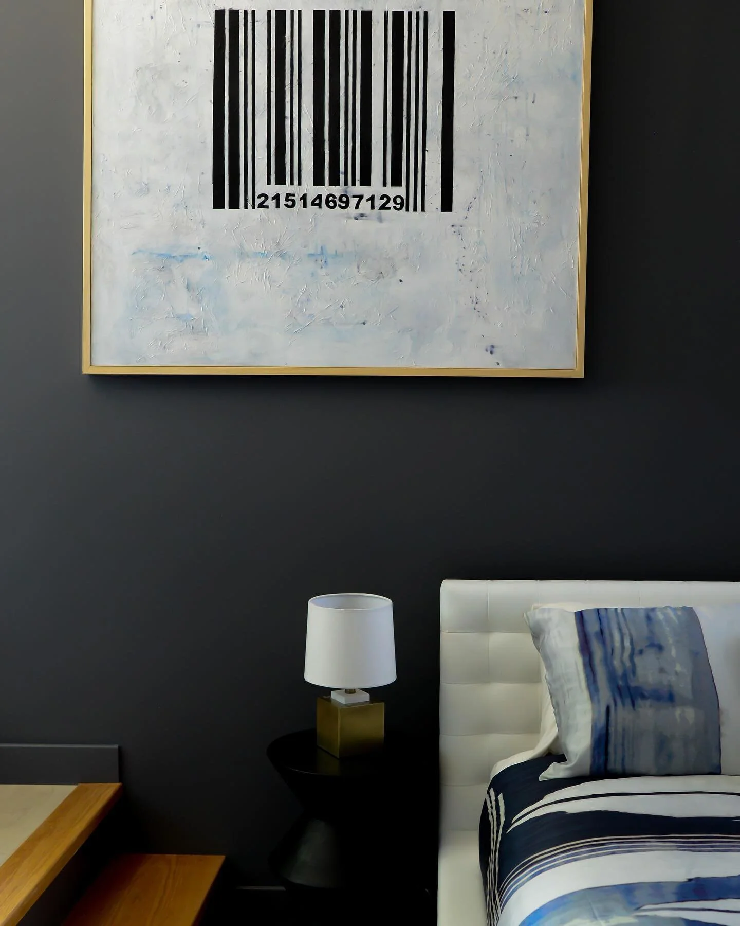 We love this custom art work created by the very talented @elviratrippatelier . She incorporated the clients name into the barcode, which was such a fun touch. This piece really helped tie the room together in this rental property. 

📸: @elviratripp