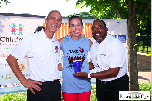 Kennesaw Mayor Derek Easterling and Rev. John Harris of Thankful Baptist Church with a winner after the race. 