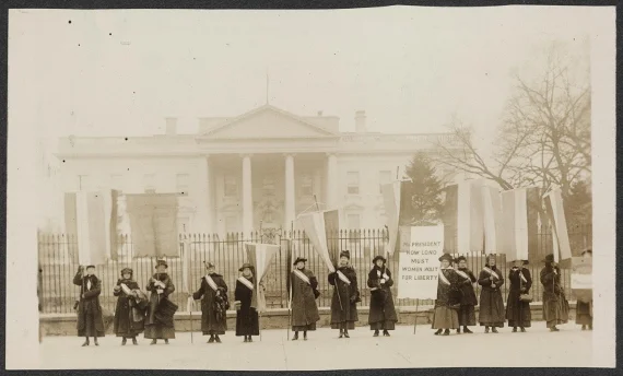 Suffragists picketing in front of the White House in 1917. (Harris & Ewing/Library of Congress). Learn more about "Alice Paul's Enduring Legacy of Nonviolent Action."