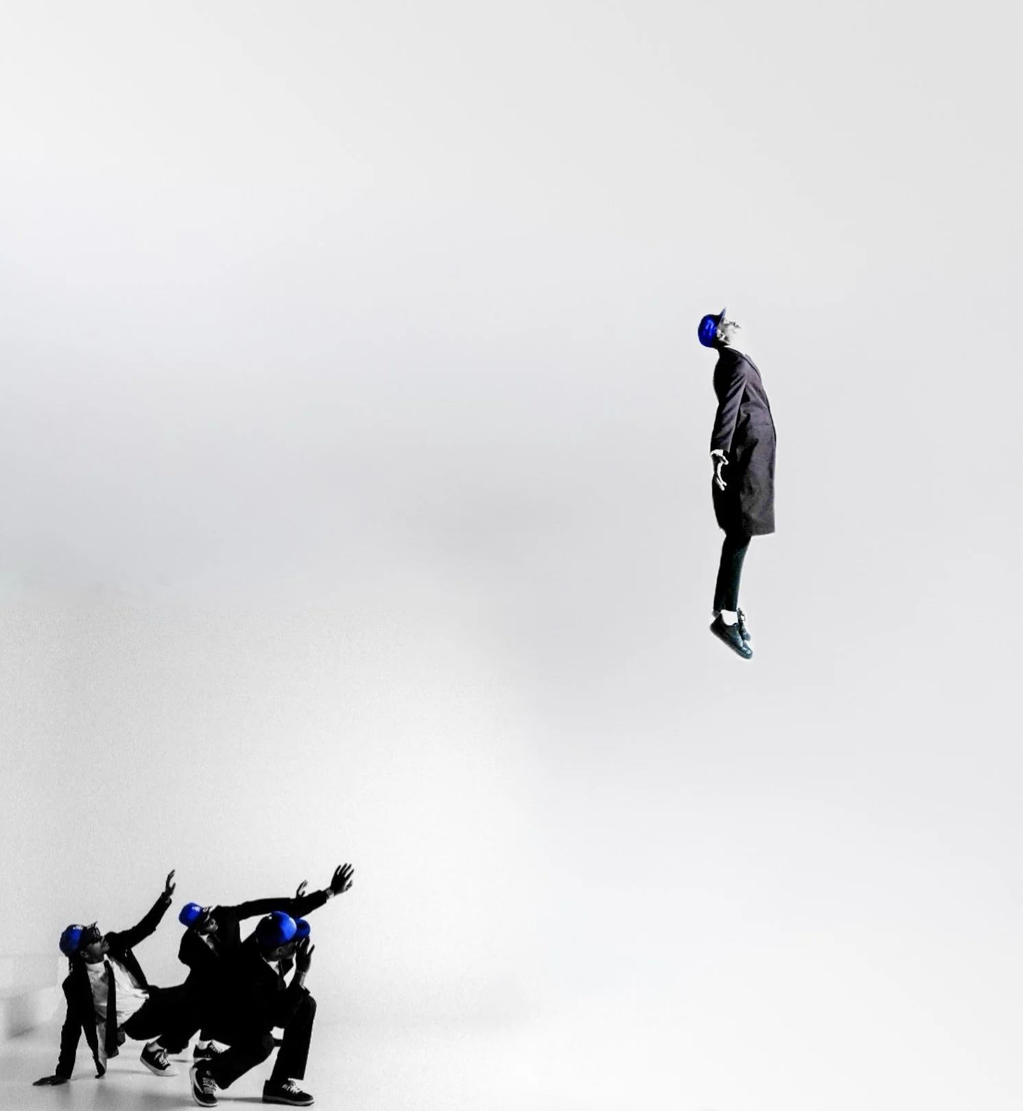 A suited figure appears suspended above three reaching models in Dodger Blue. Photography by Yonathan Mesfun.