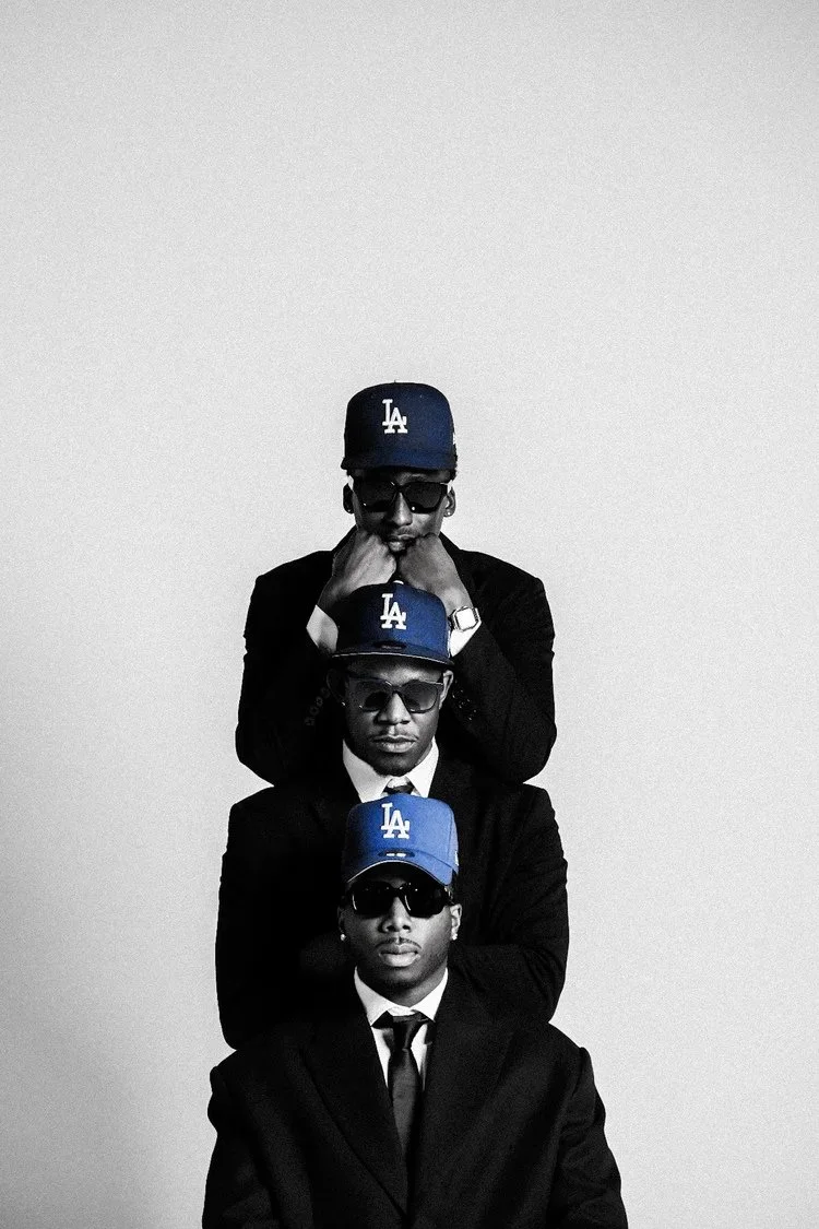 Three suited models aligned vertically in blue LA caps for Dodger Blue. Photography by Yonathan Mesfun.