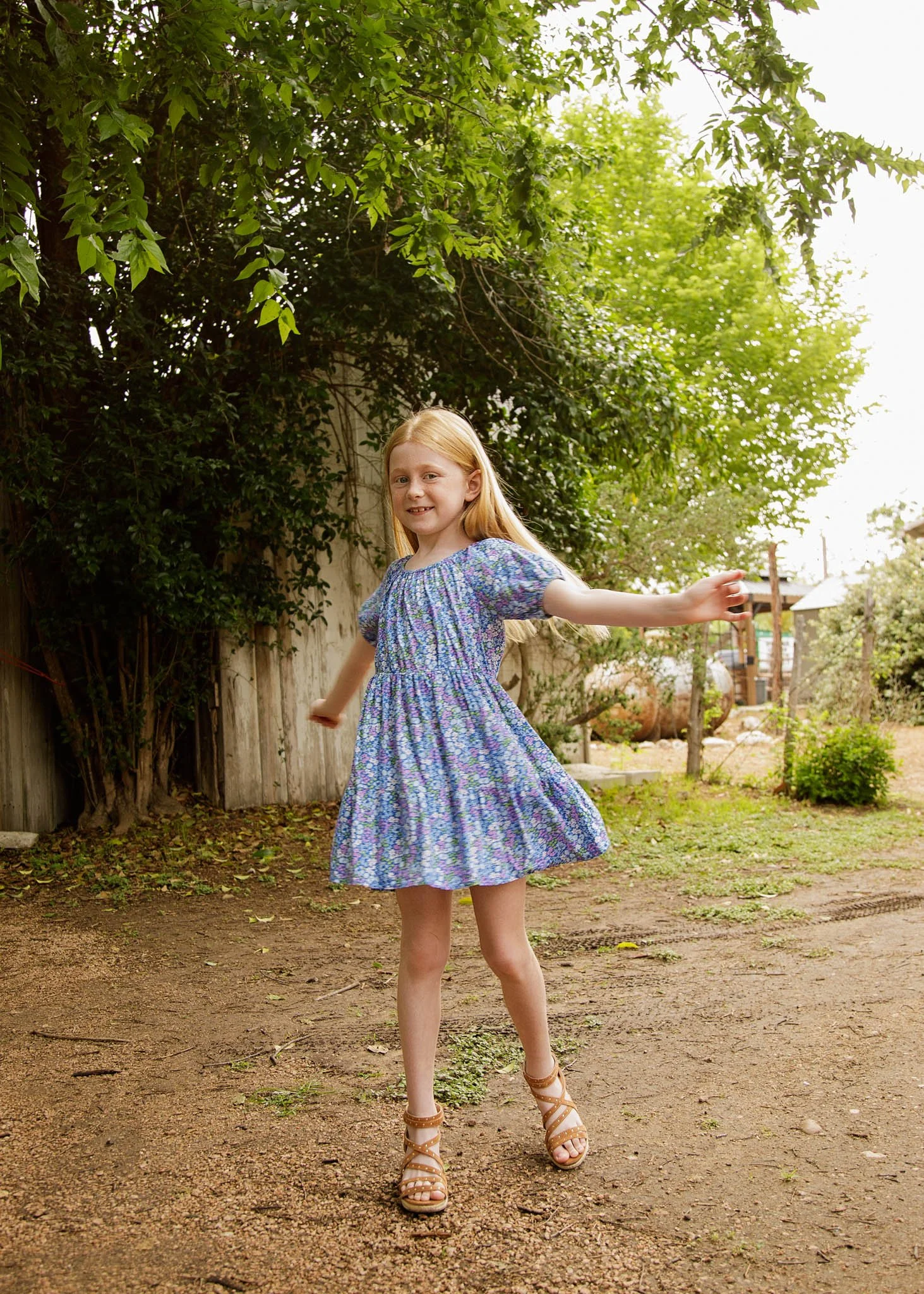 tween girl twirling outdoor family photoshoot gruene texas