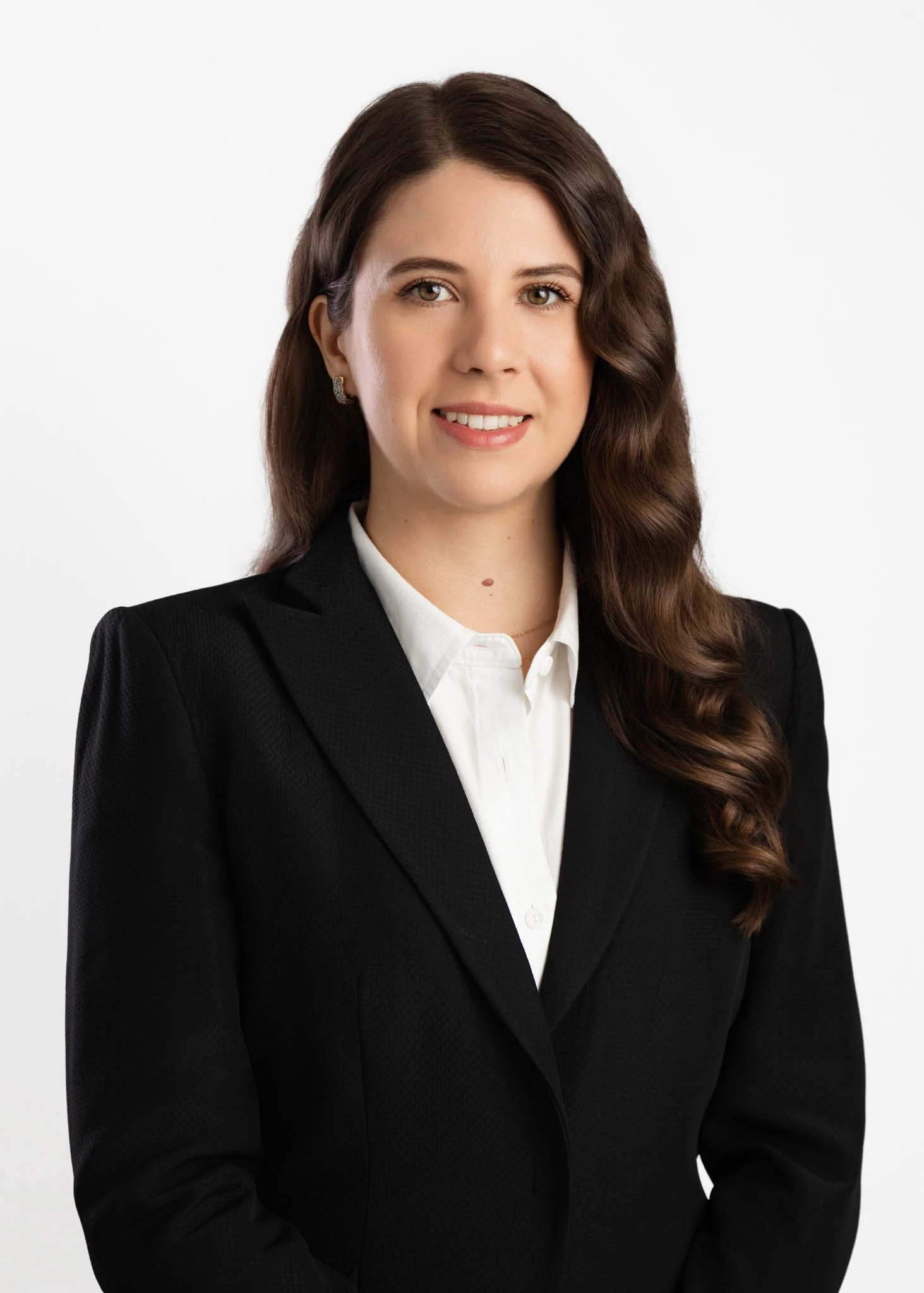 professional headshot of woman smiling in suit jacket white shirt in new braunfels studio by erin valkner photography