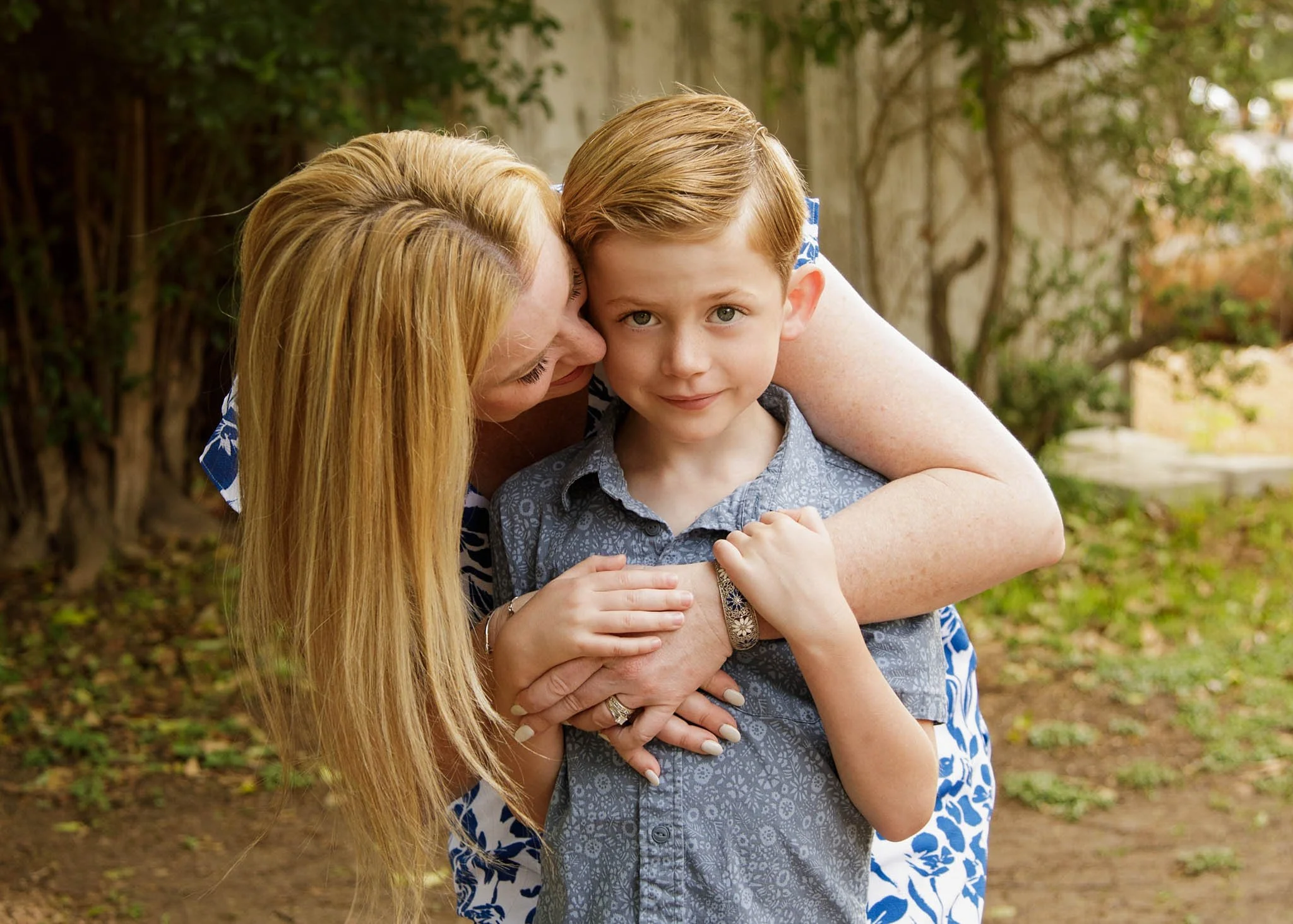 portrait of mom hugging son in Gruene texas by erin valkner photography of New braunfels texas
