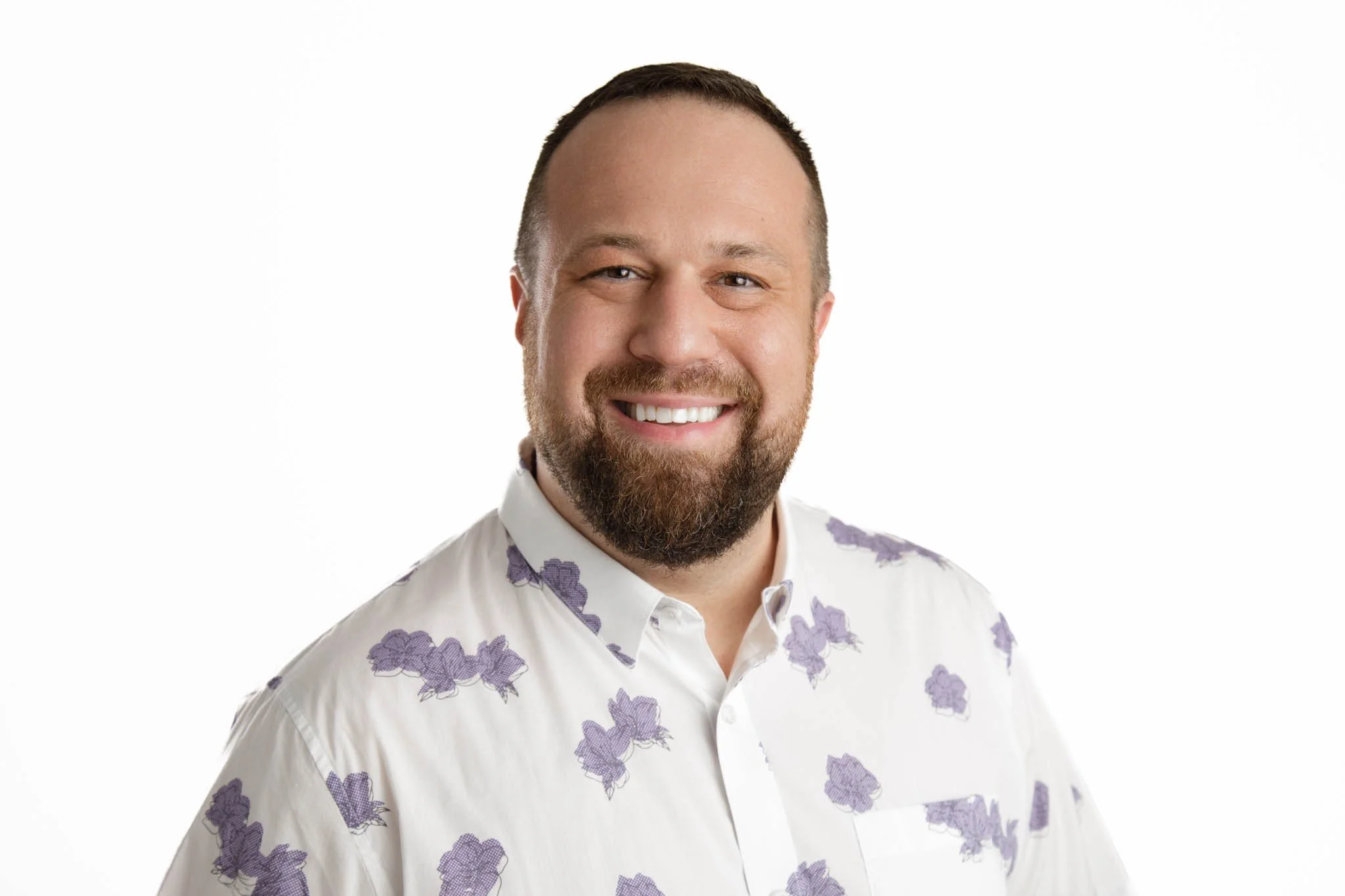 ‍professional headshot of man in casual shirt on white background in New Braunfels studio  / Photo by Erin Valkner Photography of New Braunfels, Texas. See more at www.erinvalknerphotography.com/blog