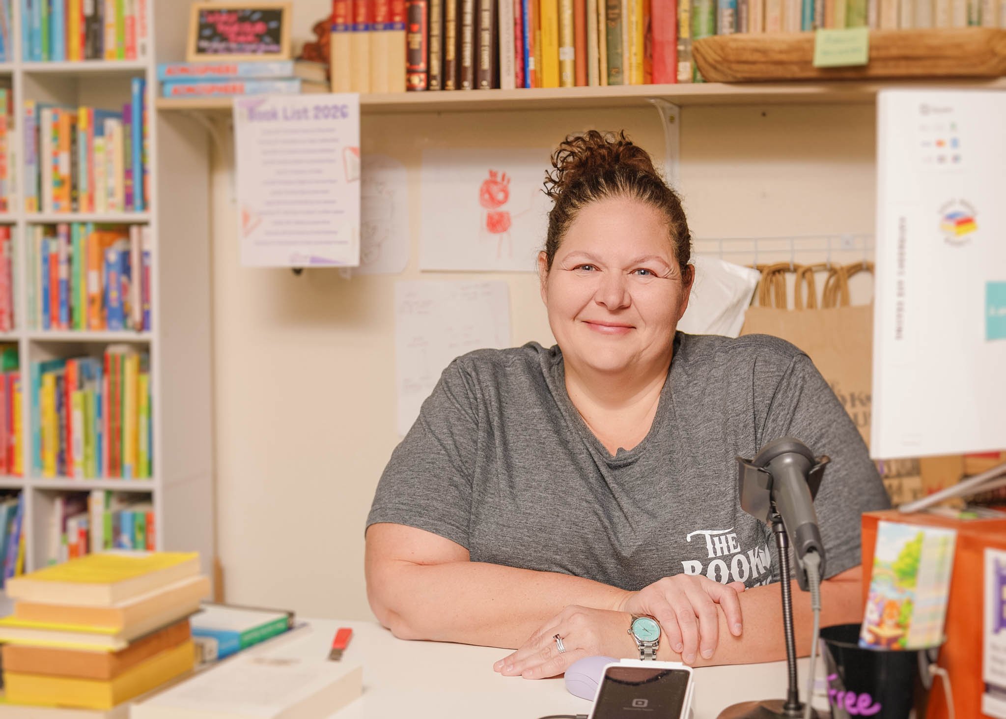 Sabrina Caldwell, owner of The Book Haus, seated at desk inside the bookstore  / Photo by Erin Valkner Photography of New Braunfels, Texas. See more at www.erinvalknerphotography.com/blog