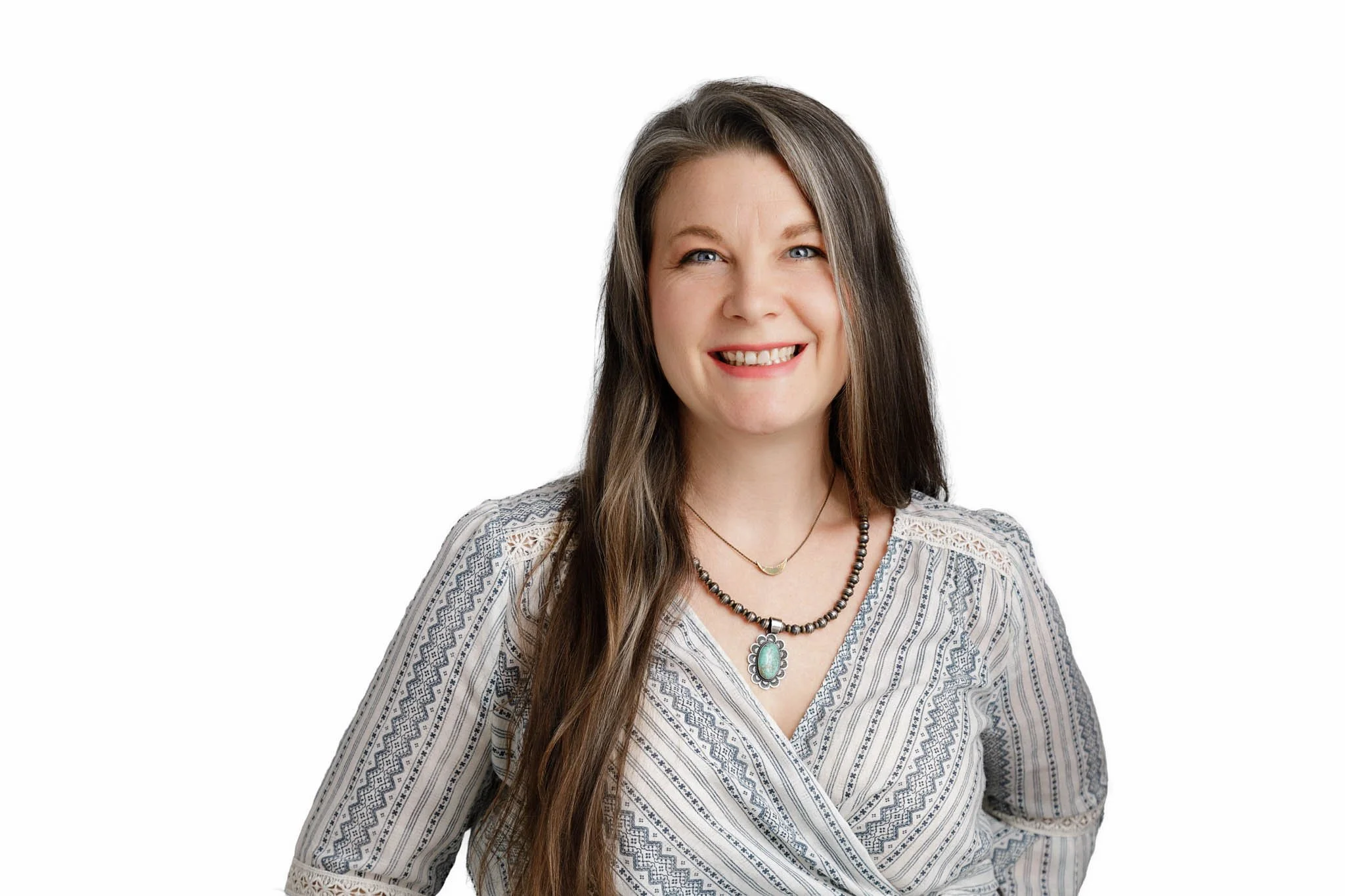 headshot of woman smiling white backdrop / Photo by Erin Valkner Photography of New Braunfels, Texas. See more at www.erinvalknerphotography.com/blog