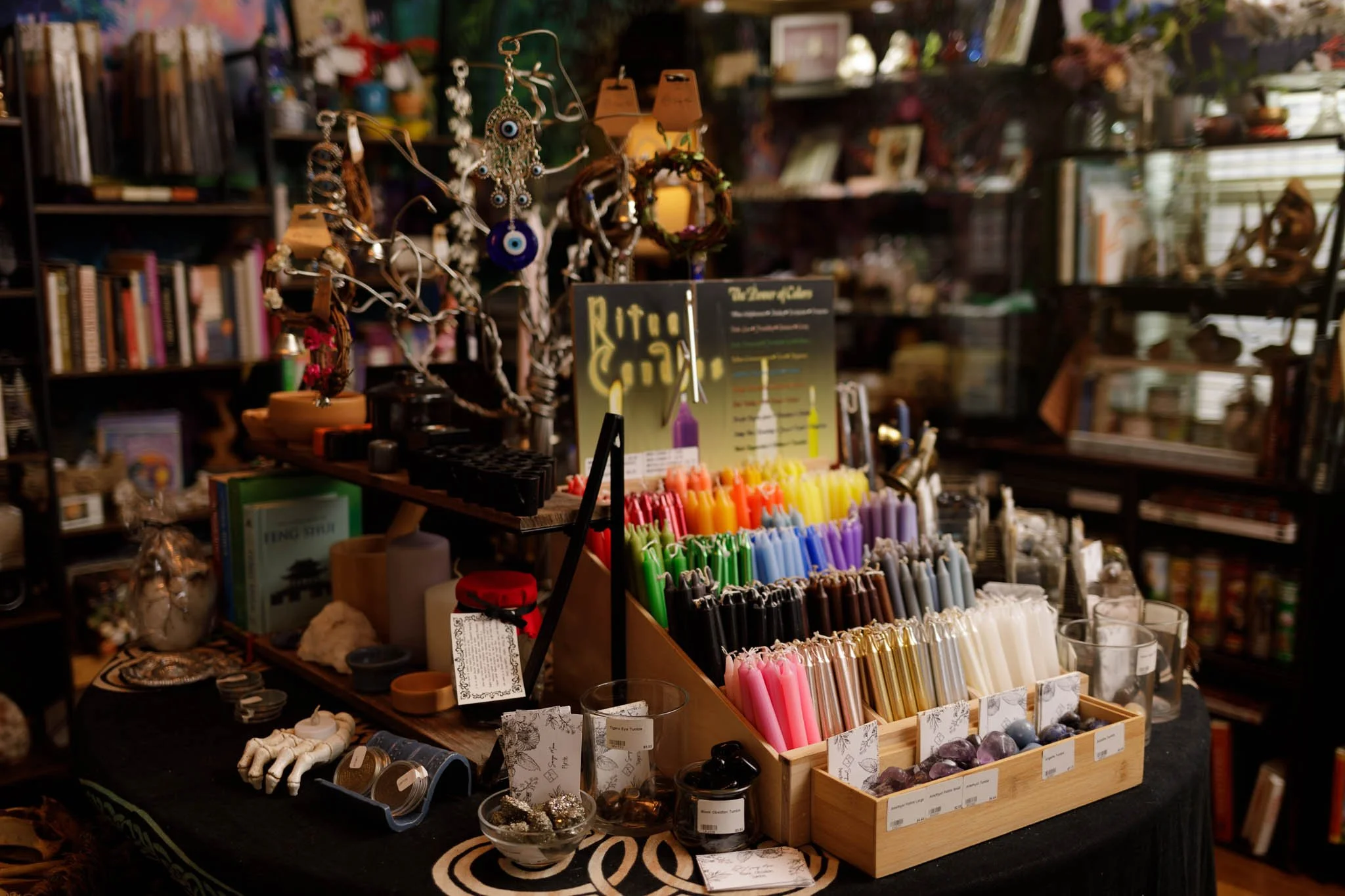 Interior photo of display table of products at Savage Mana metaphysical store / Photo by Erin Valkner Photography of New Braunfels, Texas. See more at www.erinvalknerphotography.com/blog