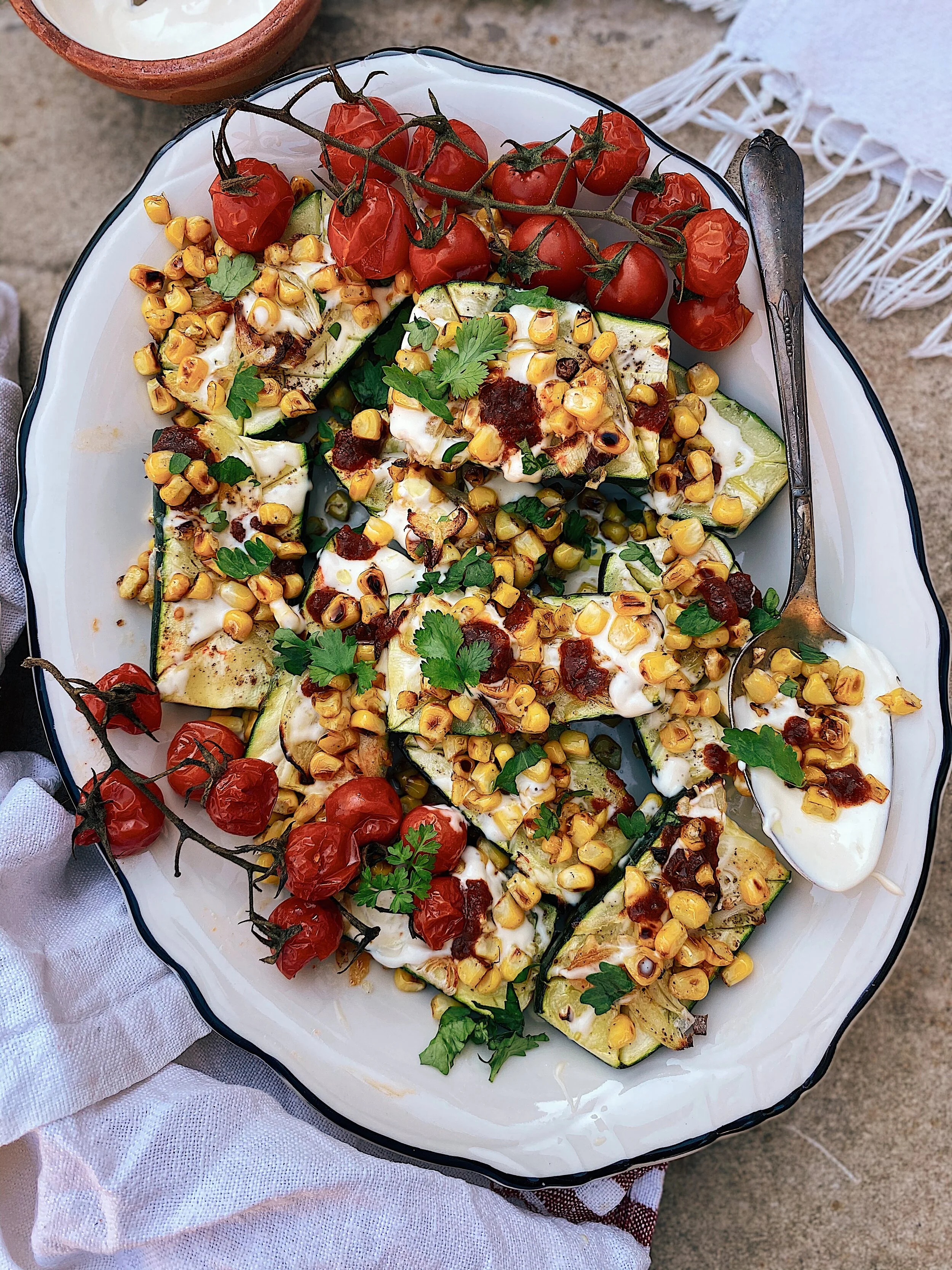 Baked Zucchini With Toasted Elote, Creme Fraiche and Chipotle.