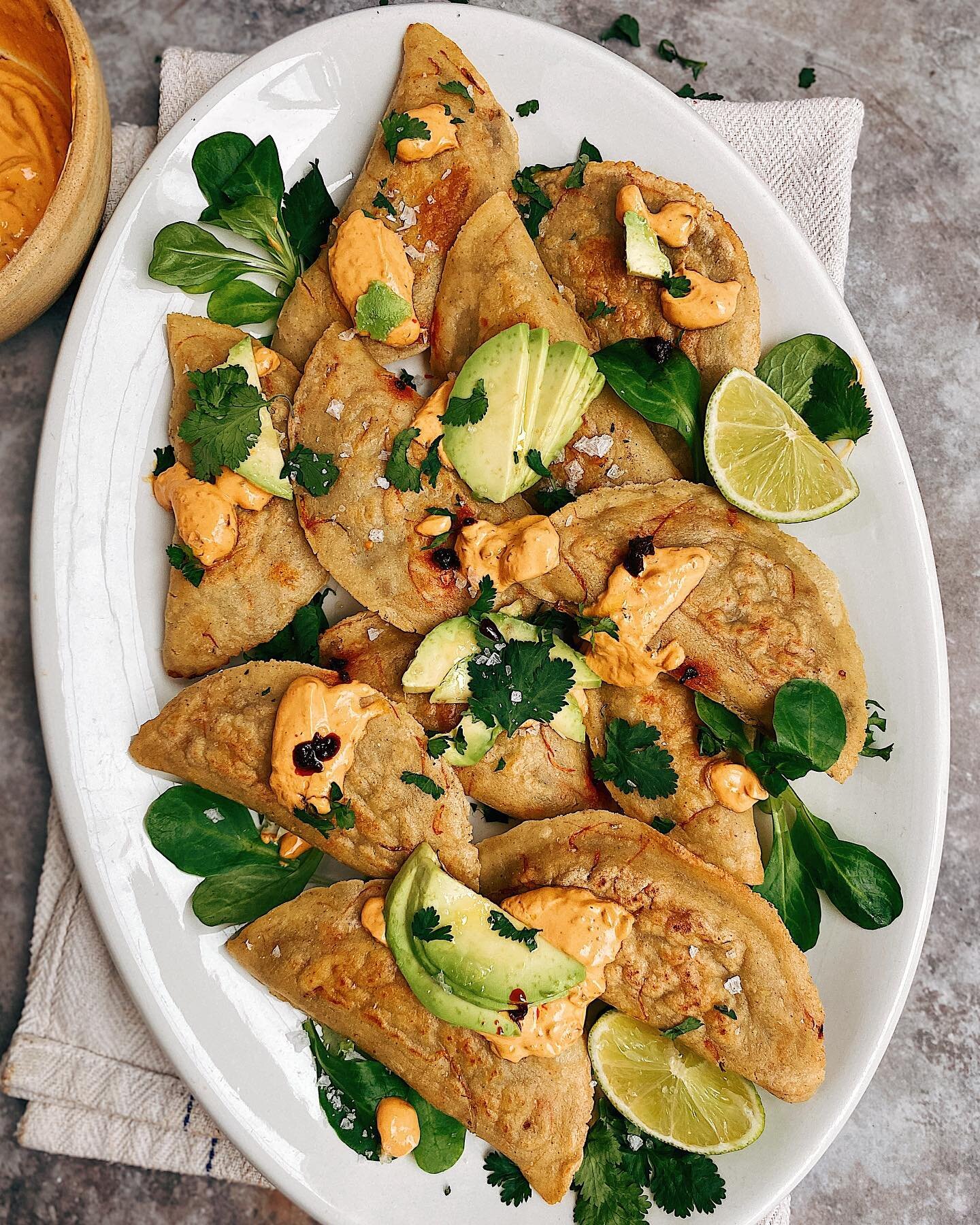 Lentil picadillo empanadas with spicy yoghurt crema ! I made the empanadas extra special by adding dried calendula petals from my garden into the masa , they add such a pretty color and touch .
To me the this is balance between a bit naughty and heal